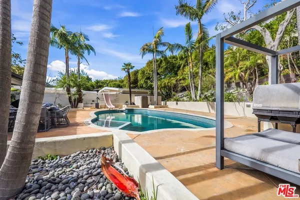 a view of an outdoor sitting area with furniture
