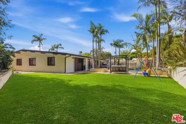 a view of an entrance gate of the house and front view of a house