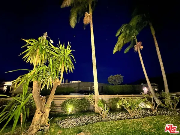 a view of a swimming pool with an outdoor space and seating area