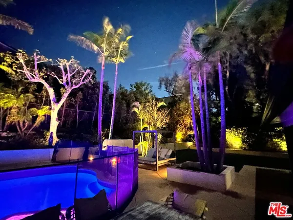 a view of swimming pool with a garden