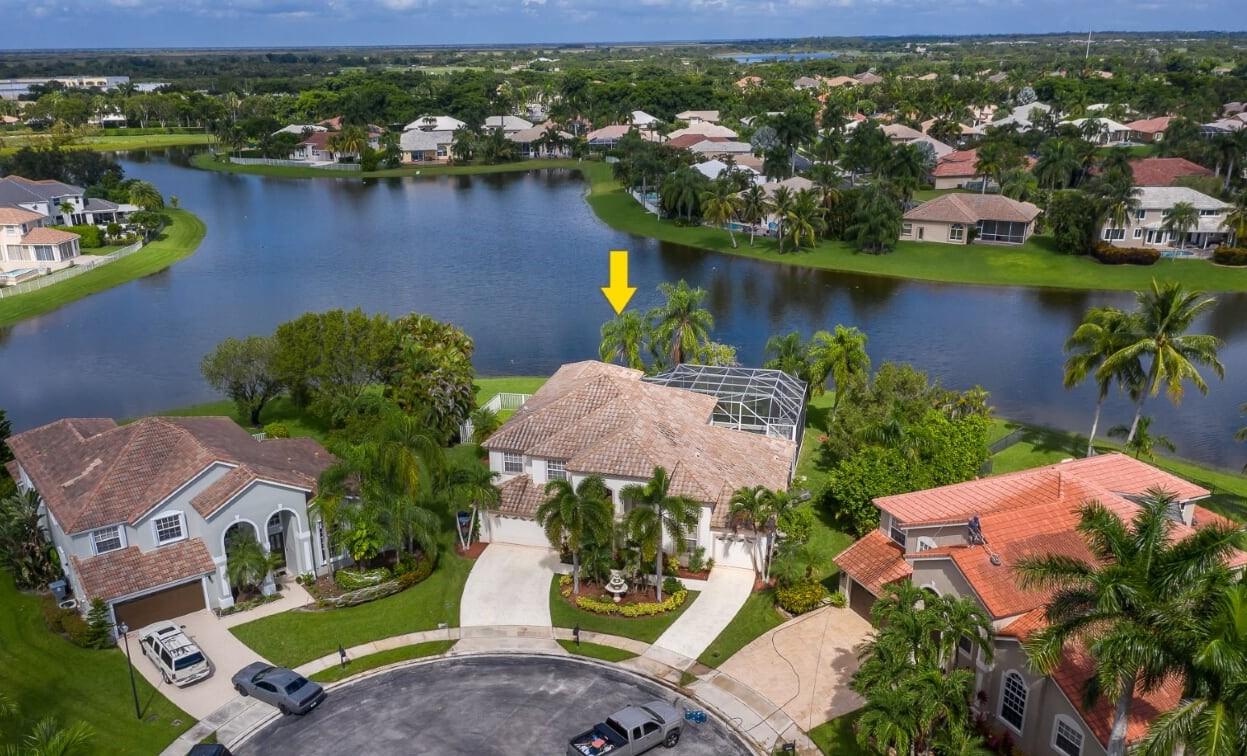 21605 Halstead Drive Boca Raton, FL 33428 - Photo 1 of 43 an aerial view of residential houses with outdoor space and lake view