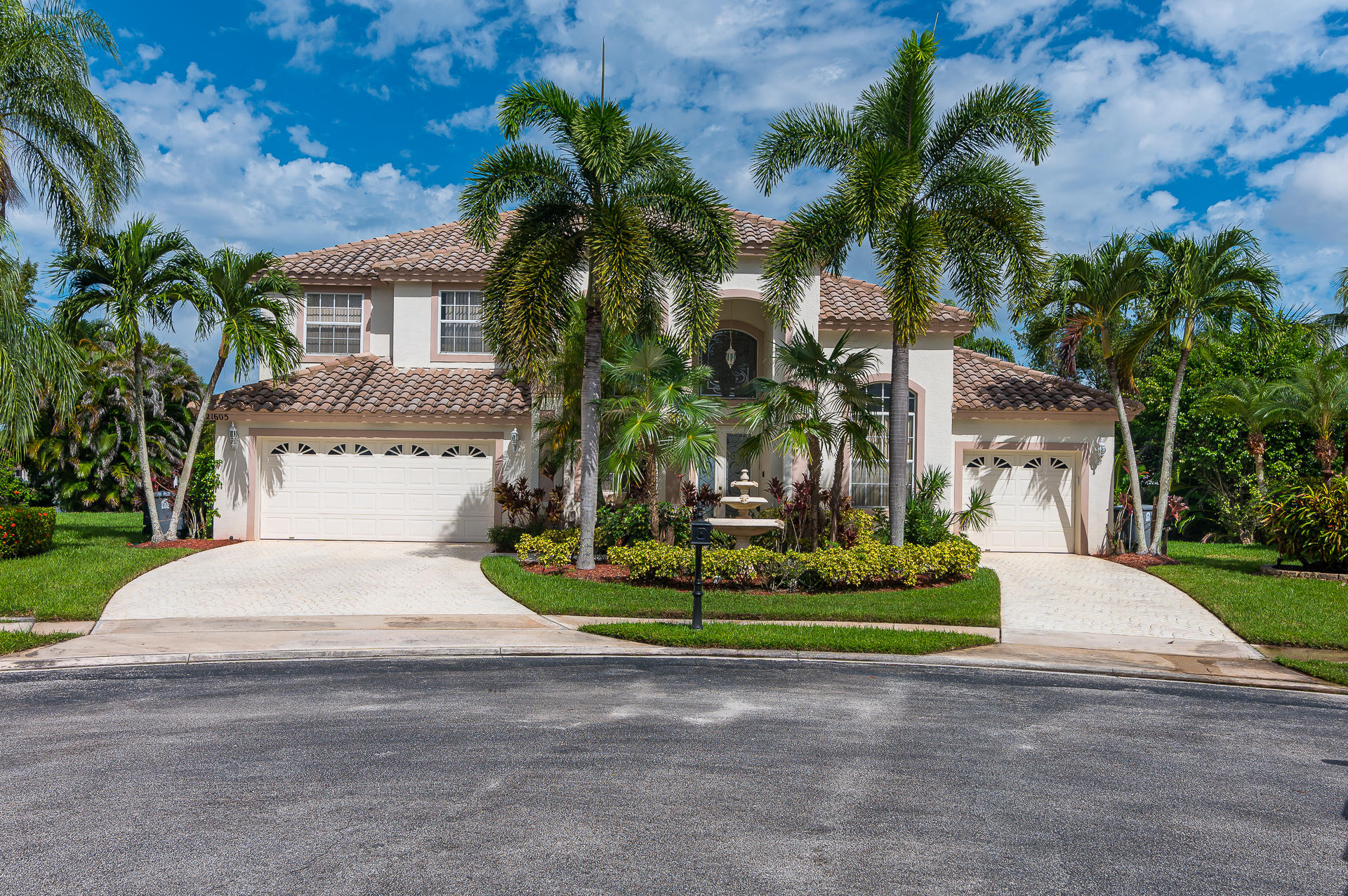 21605 Halstead Drive Boca Raton, FL 33428 - Photo 2 of 43 a front view of a house with a garden