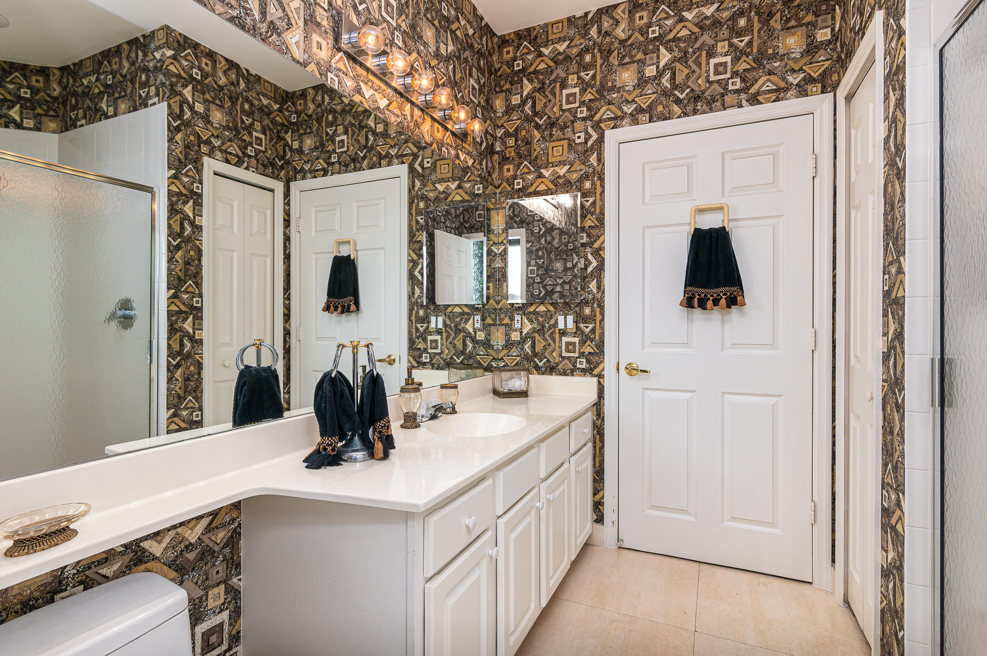 21605 Halstead Drive Boca Raton, FL 33428 - Photo 13 of 43 a bathroom with a double vanity sink toilet and shower