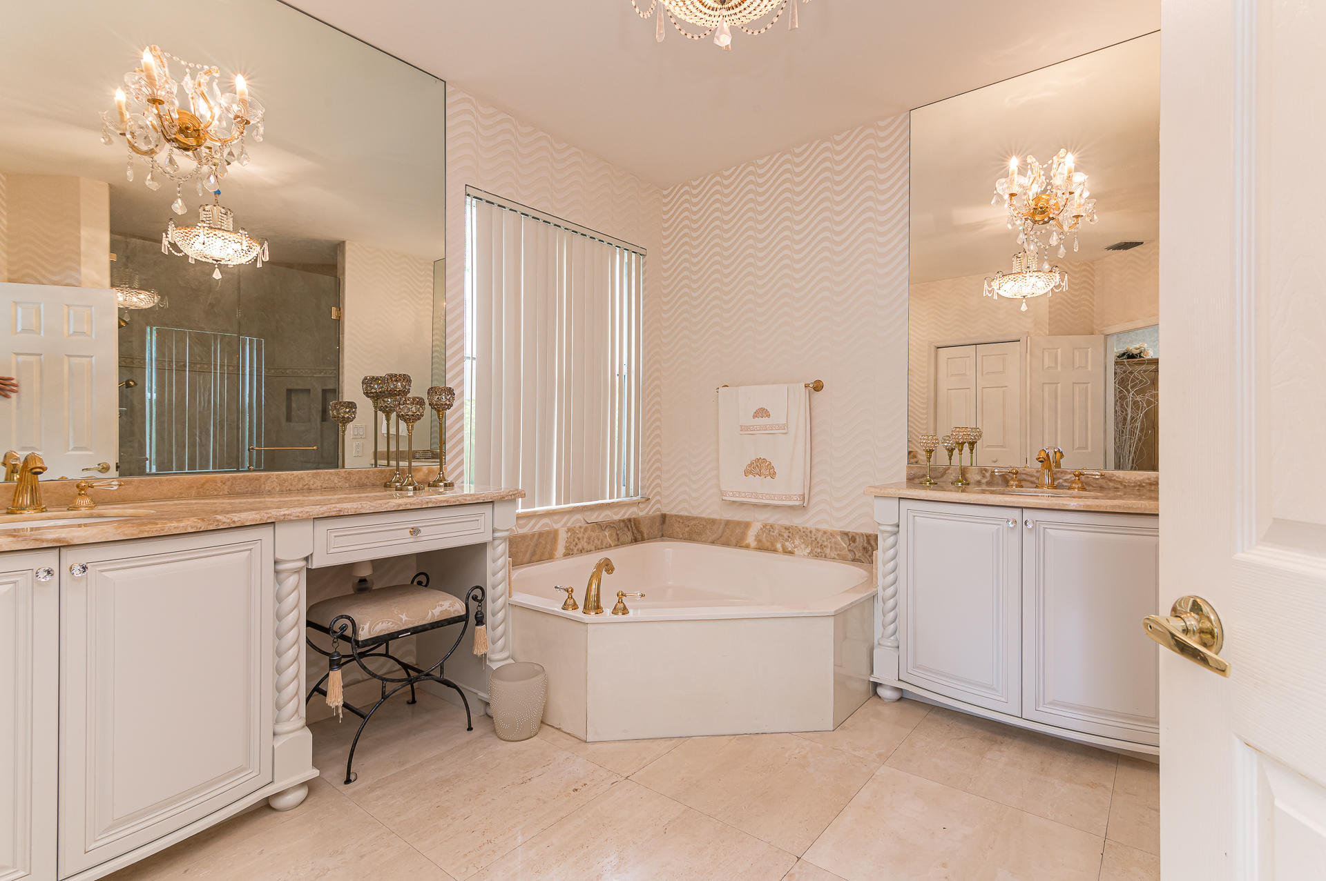 21605 Halstead Drive Boca Raton, FL 33428 - Photo 14 of 43 a bathroom with a tub a double vanity sink and mirror