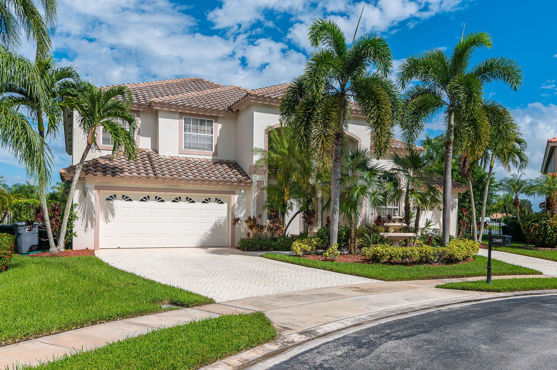 21605 Halstead Drive Boca Raton, FL 33428 - Photo 3 of 43 a front view of a house with a yard and garage