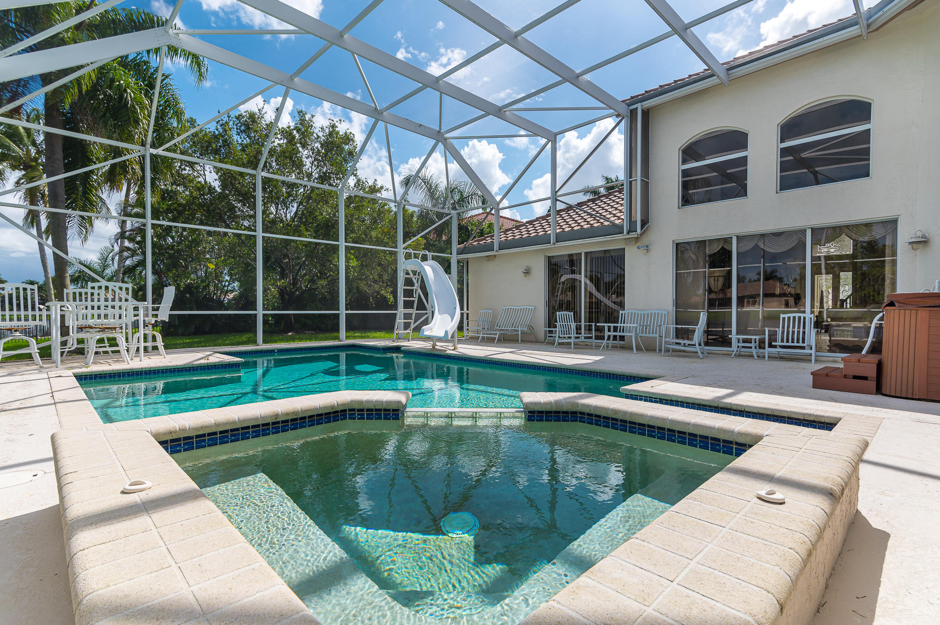 21605 Halstead Drive Boca Raton, FL 33428 - Photo 29 of 43 a view of a house with a swimming pool
