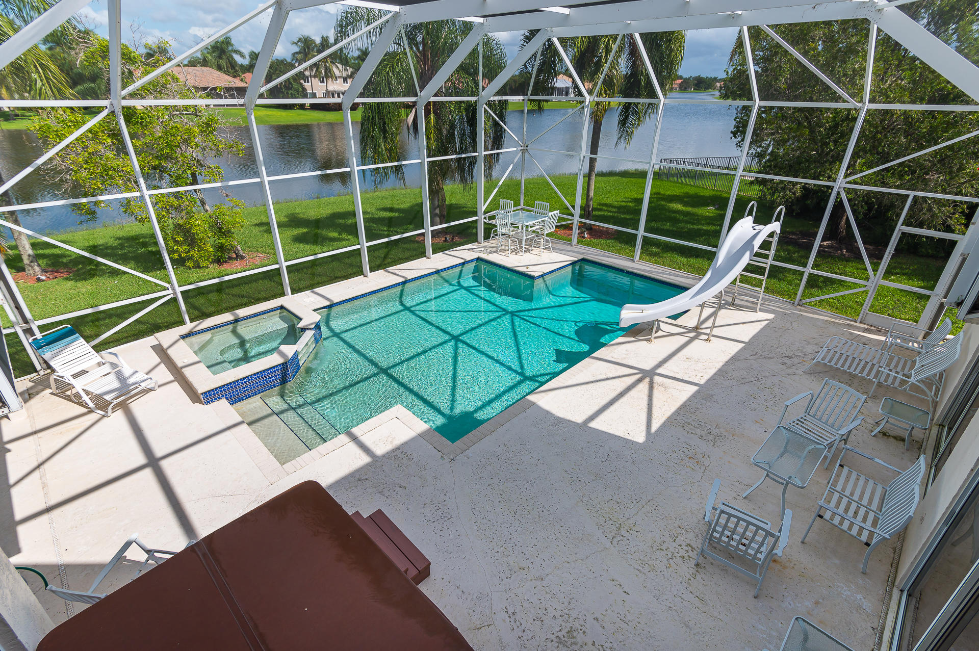 21605 Halstead Drive Boca Raton, FL 33428 - Photo 30 of 43 a view of an outdoor space with a swimming pool