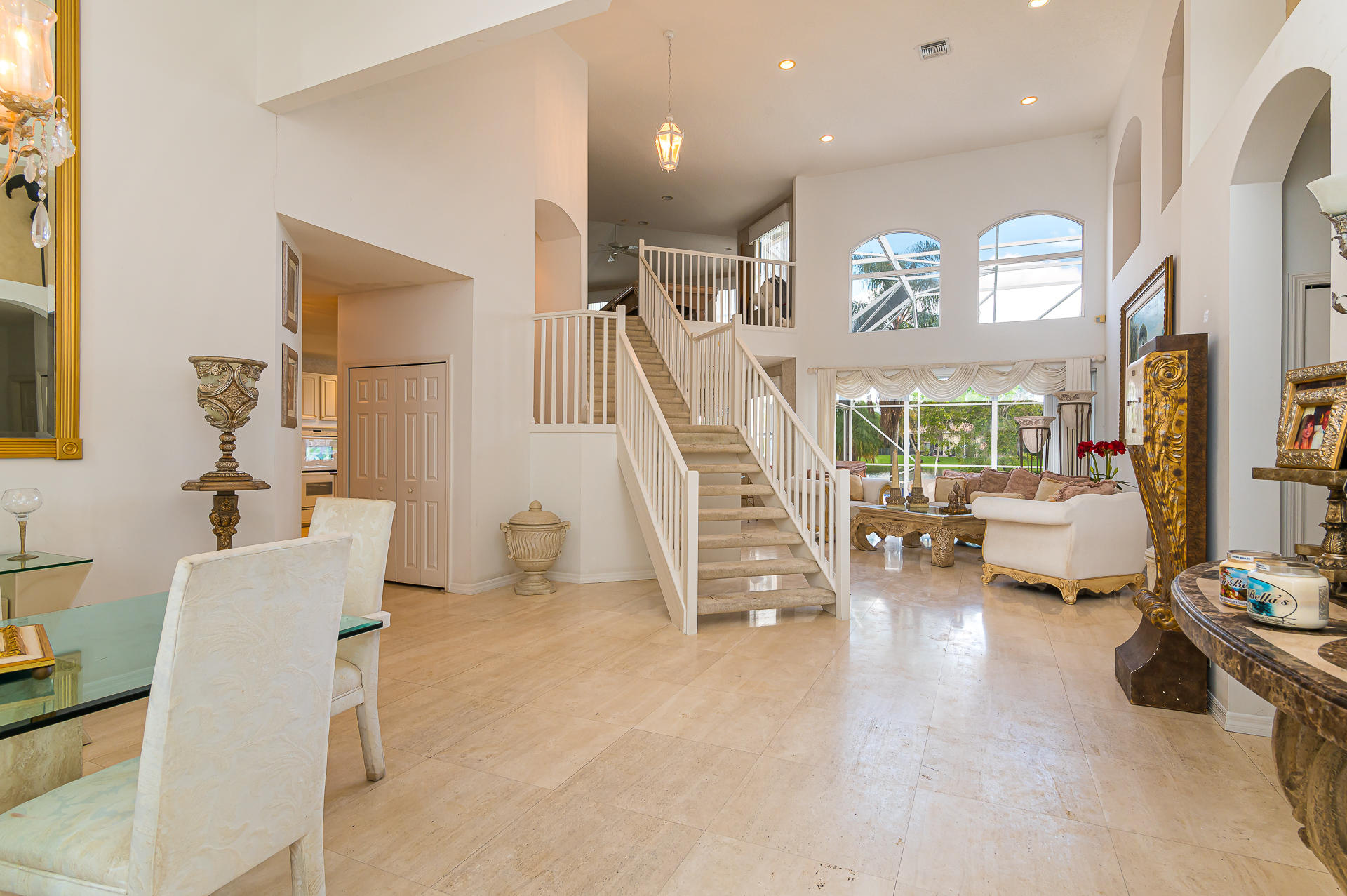 21605 Halstead Drive Boca Raton, FL 33428 - Photo 4 of 43 a living room with furniture and a large mirror