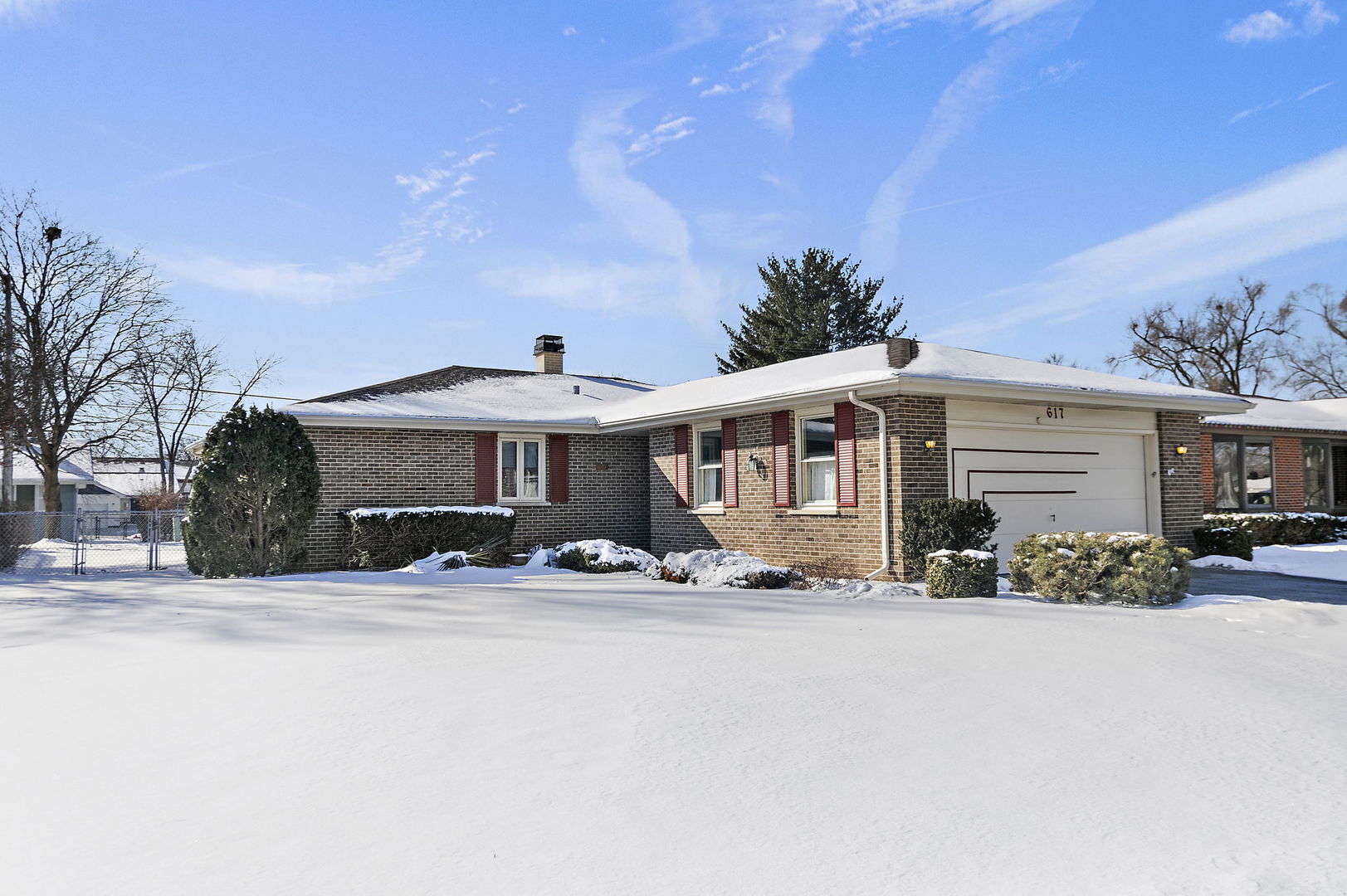 a front view of a house with yard