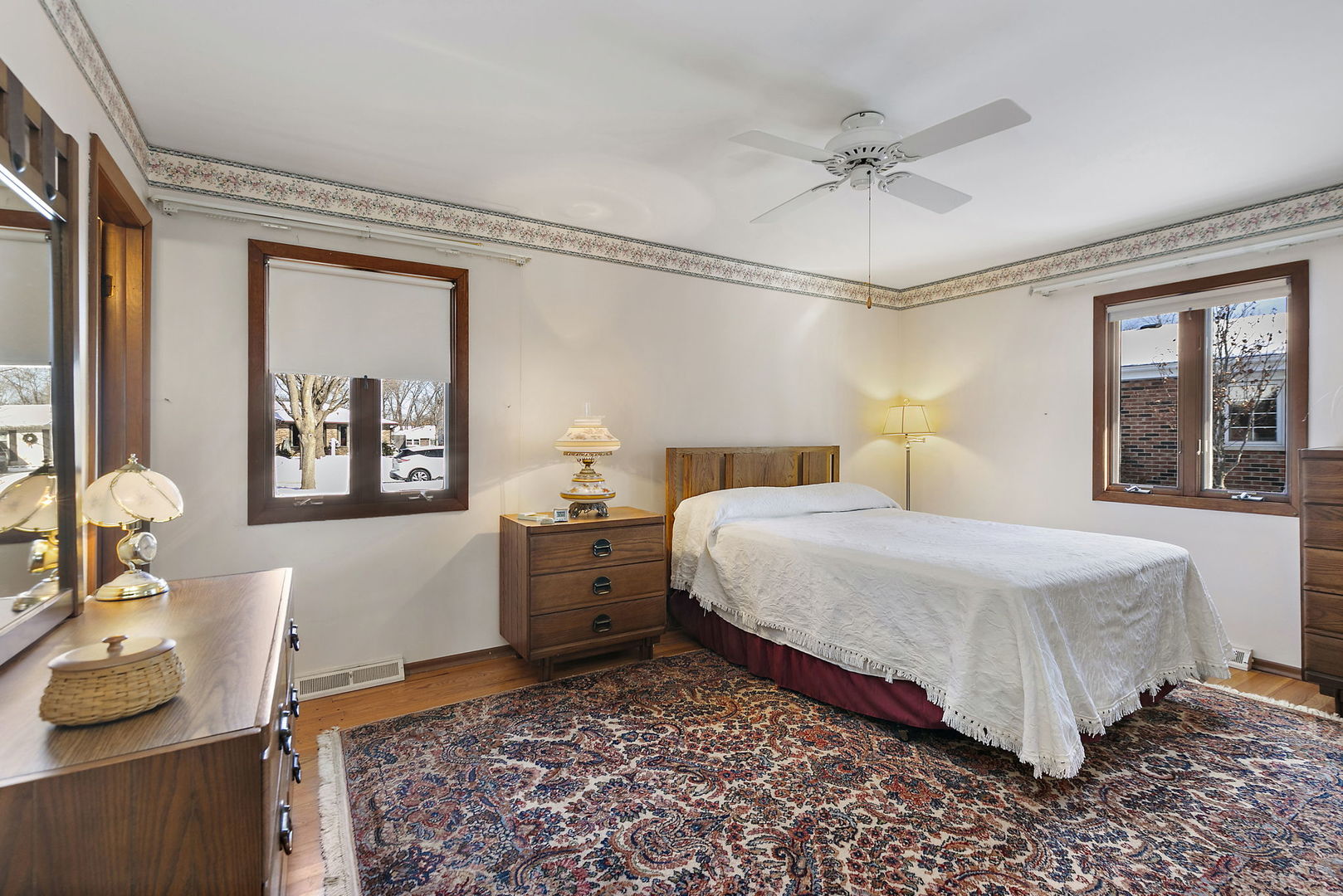 617 Sharon Drive Crystal Lake, IL 60014 - Photo 13 of 26 a bedroom with a bed and a large mirror next to a window