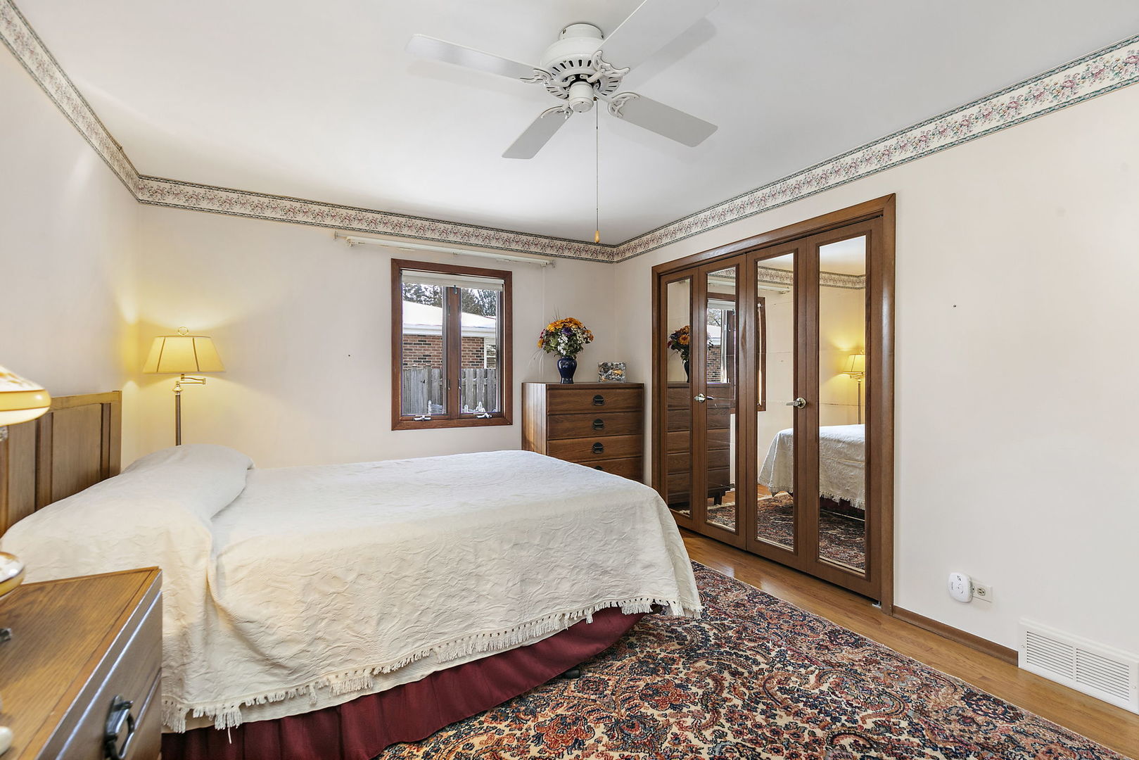 617 Sharon Drive Crystal Lake, IL 60014 - Photo 14 of 26 a bedroom with a large bed and a chandelier