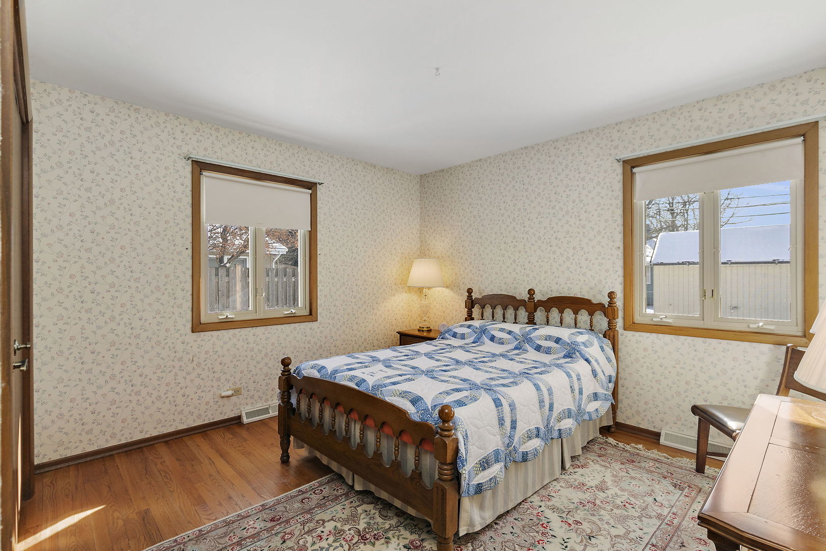 617 Sharon Drive Crystal Lake, IL 60014 - Photo 16 of 26 a bedroom with a bed lamp and a window