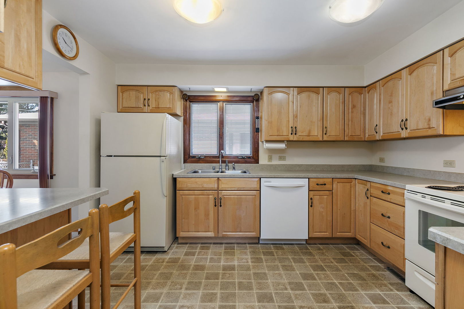 617 Sharon Drive Crystal Lake, IL 60014 - Photo 4 of 26 a kitchen with stainless steel appliances granite countertop a refrigerator sink and cabinets