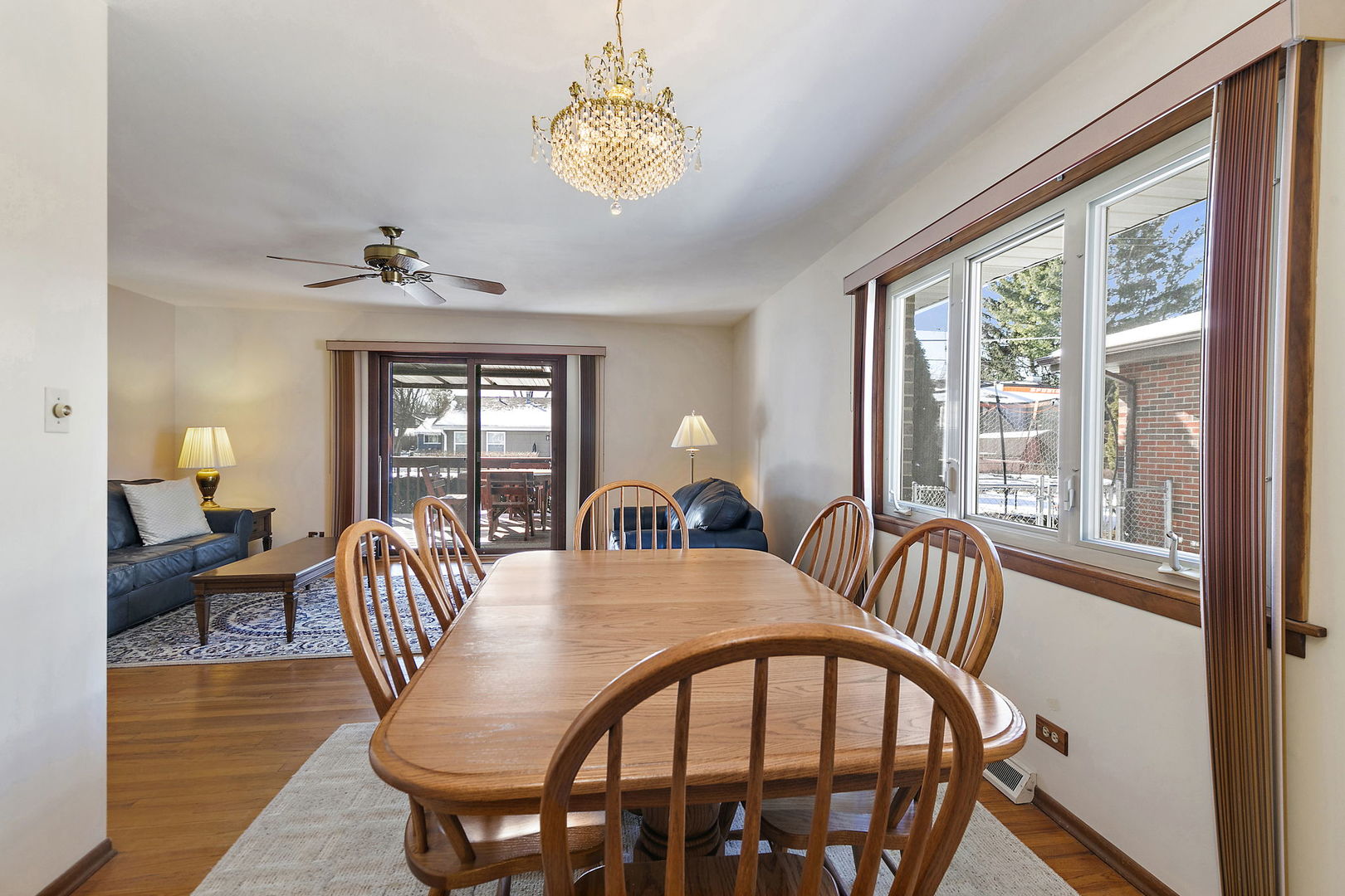 617 Sharon Drive Crystal Lake, IL 60014 - Photo 7 of 26 a view of a dining room with furniture wooden floor and chandelier