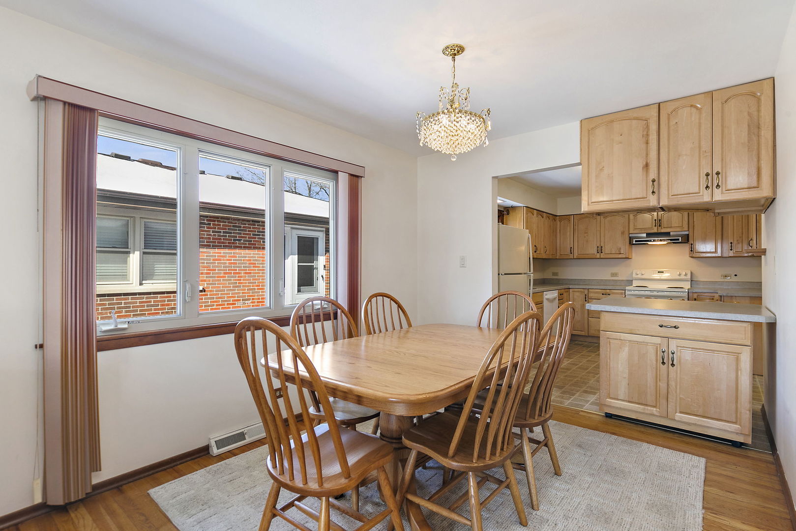 617 Sharon Drive Crystal Lake, IL 60014 - Photo 8 of 26 a view of a dining room with furniture window and wooden floor