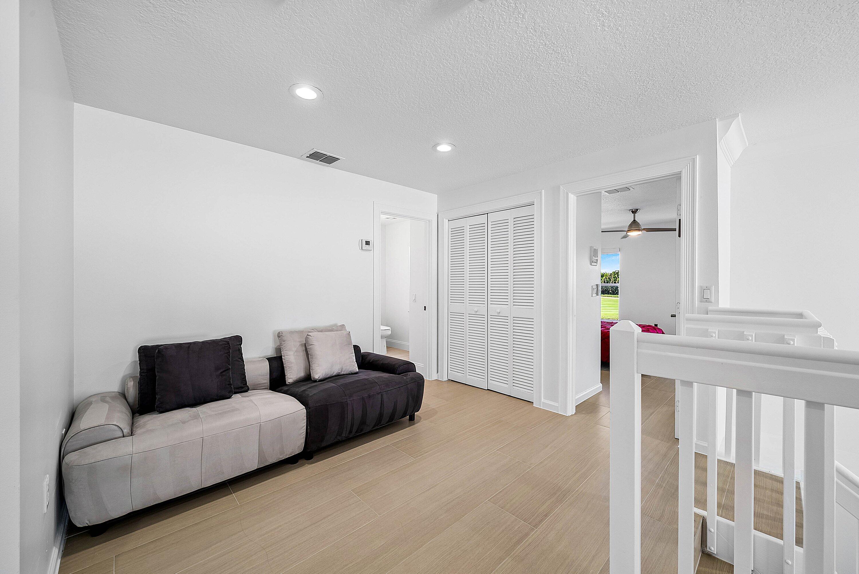 5855 Northwest 42nd Way Boca Raton, FL 33496 - Photo 26 of 77 a living room with furniture and a window
