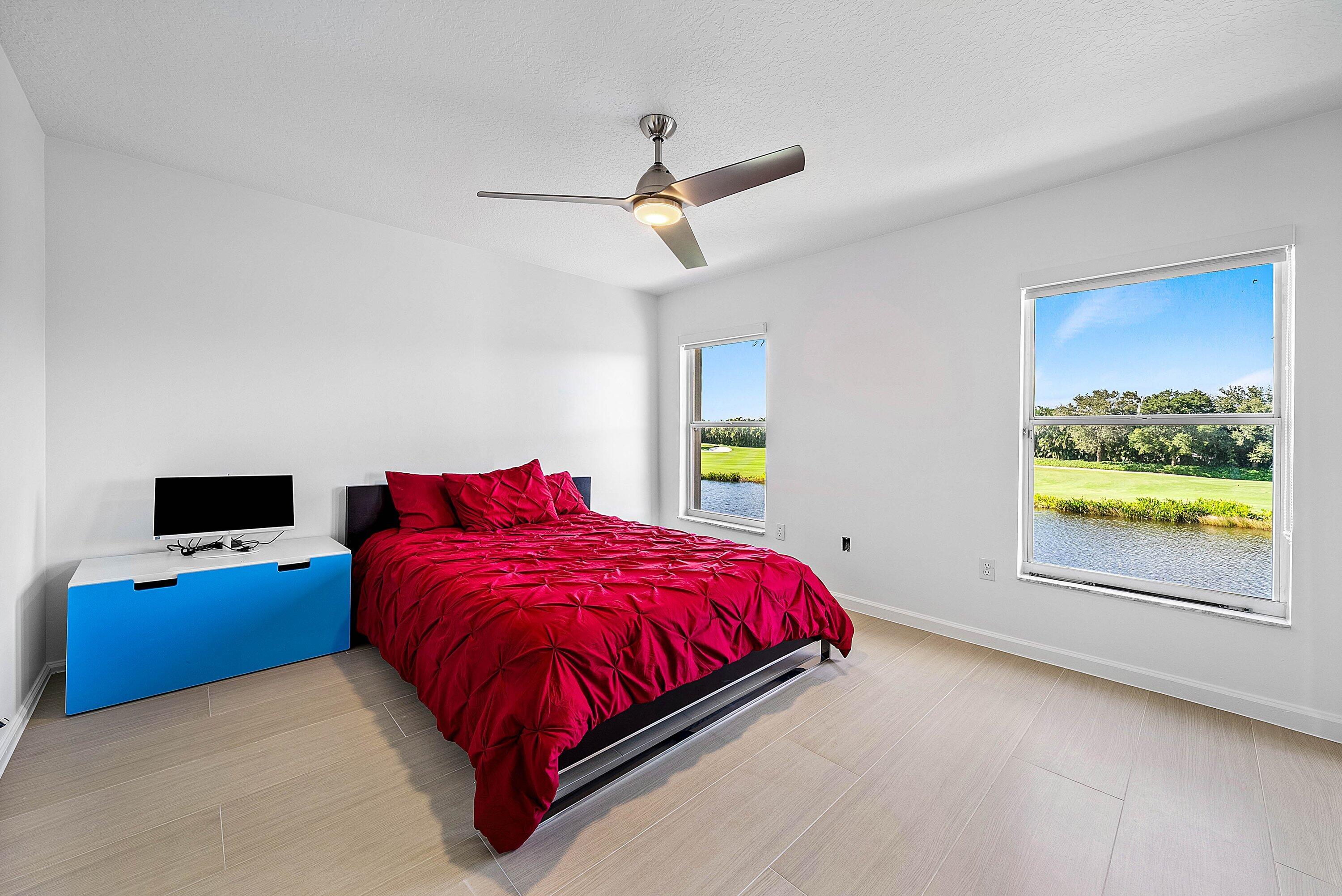 5855 Northwest 42nd Way Boca Raton, FL 33496 - Photo 34 of 77 a bed room with a bed and a window