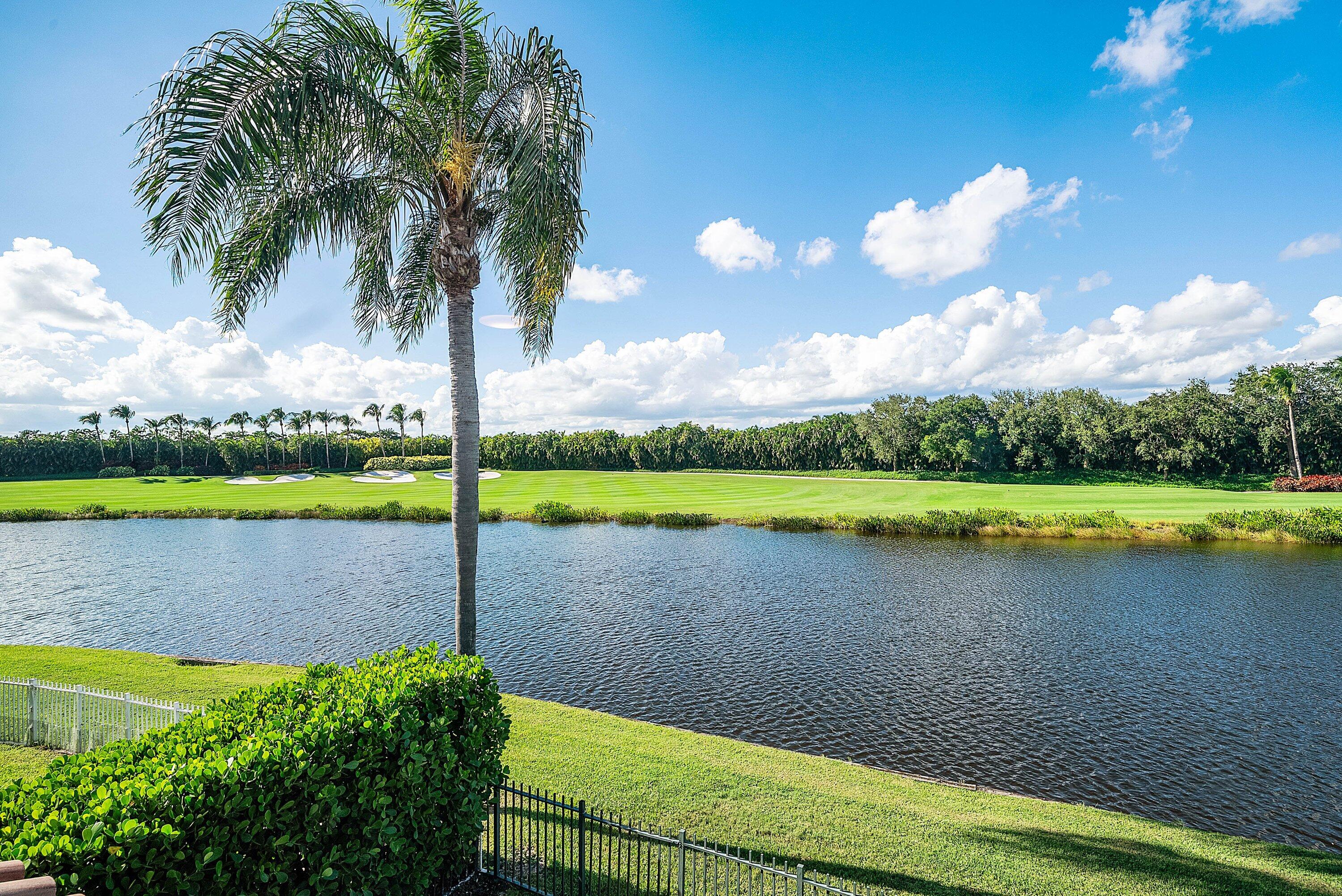 5855 Northwest 42nd Way Boca Raton, FL 33496 - Photo 36 of 77 a view of a lake with a big yard