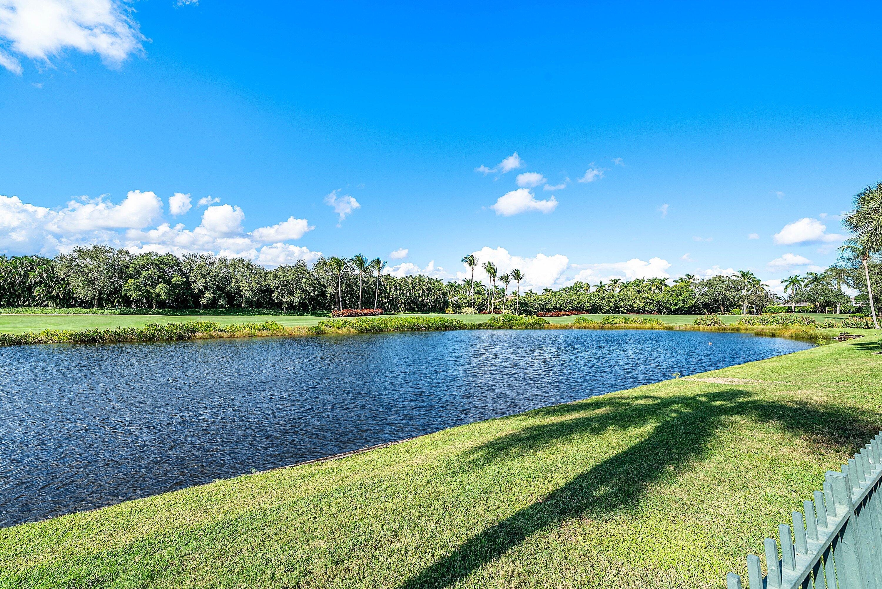 5855 Northwest 42nd Way Boca Raton, FL 33496 - Photo 41 of 77 a view of a lake with houses in the back