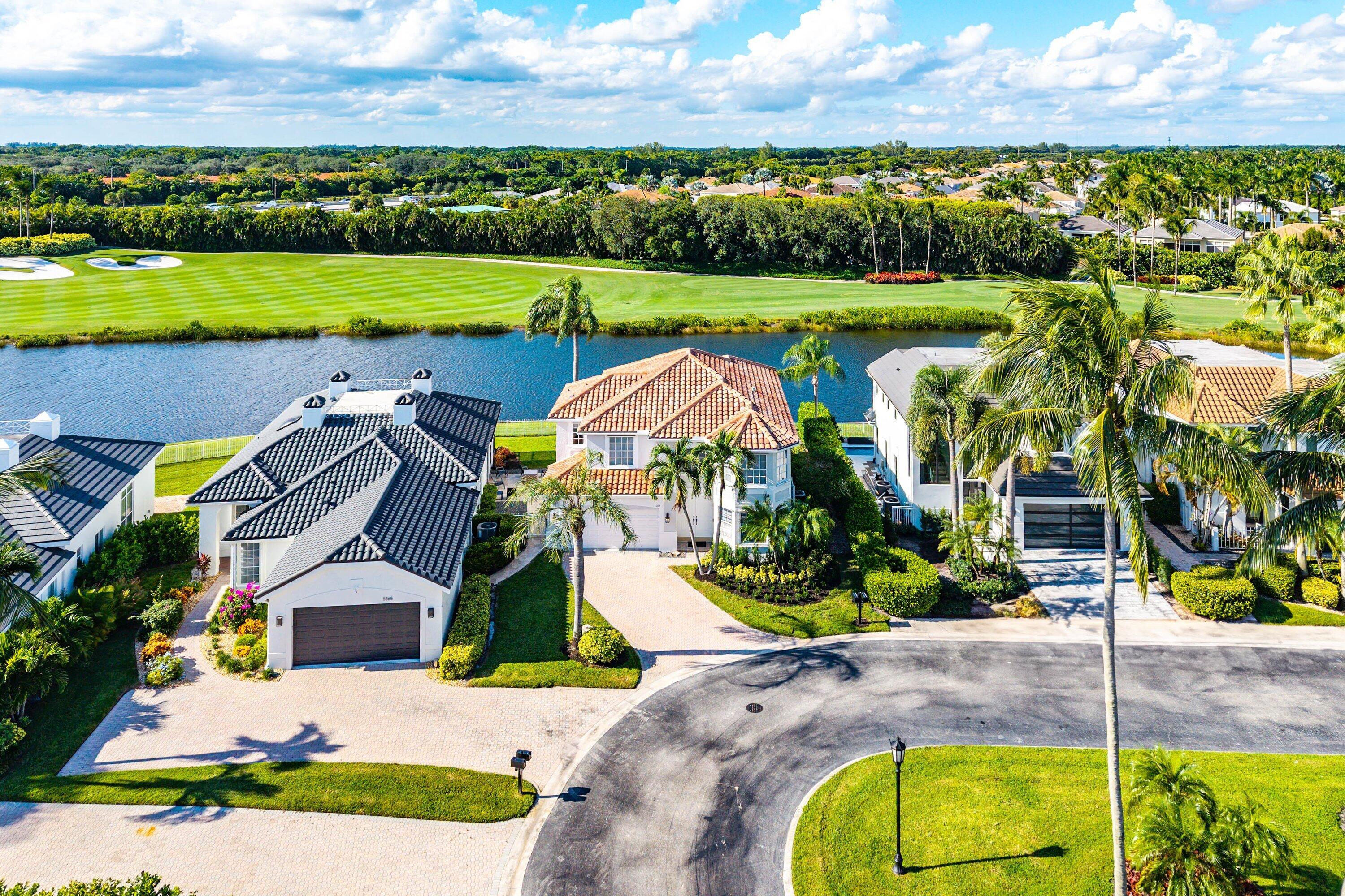 5855 Northwest 42nd Way Boca Raton, FL 33496 - Photo 47 of 77 an aerial view of a house with a garden and lake view