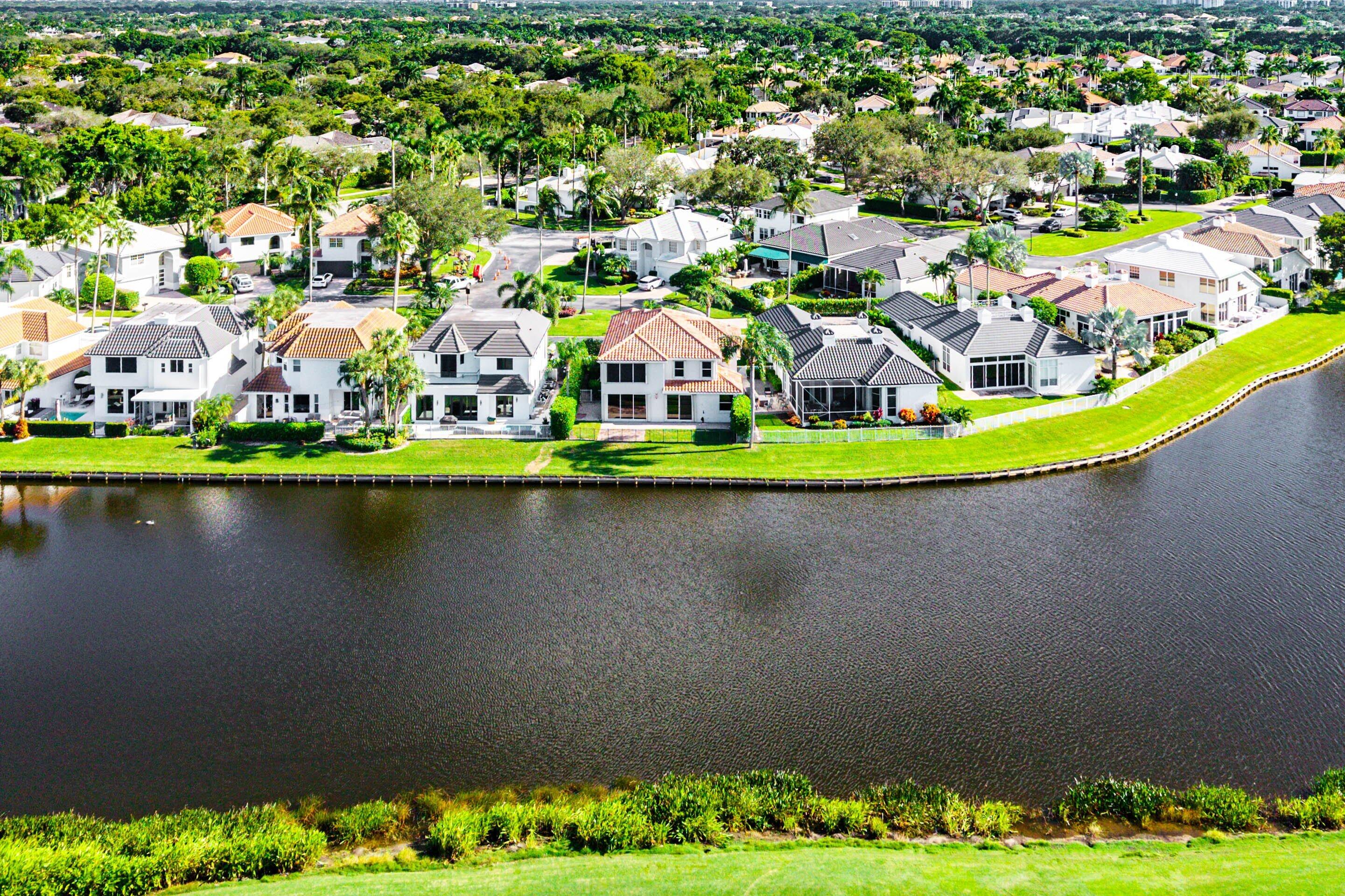 5855 Northwest 42nd Way Boca Raton, FL 33496 - Photo 55 of 77 an aerial view of a house with a garden and lake view