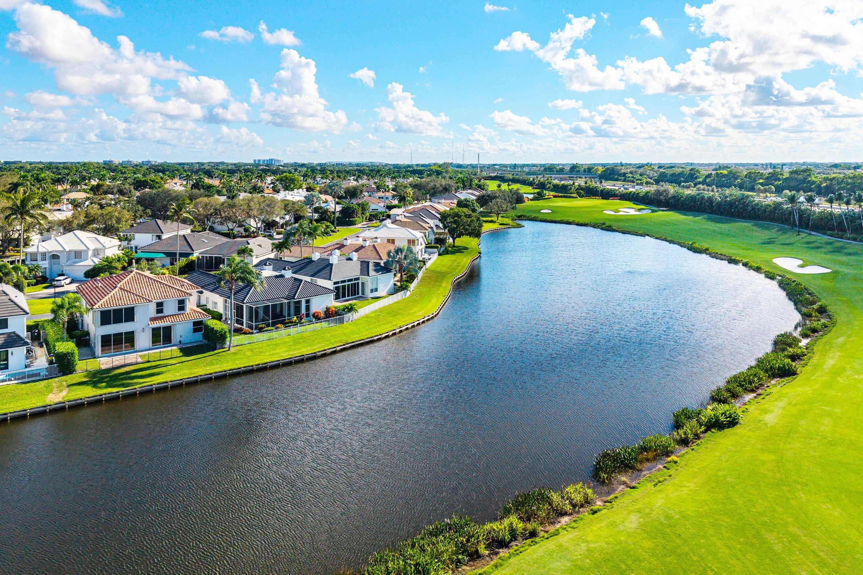 5855 Northwest 42nd Way Boca Raton, FL 33496 - Photo 59 of 77 an aerial view of a house with a garden and lake view