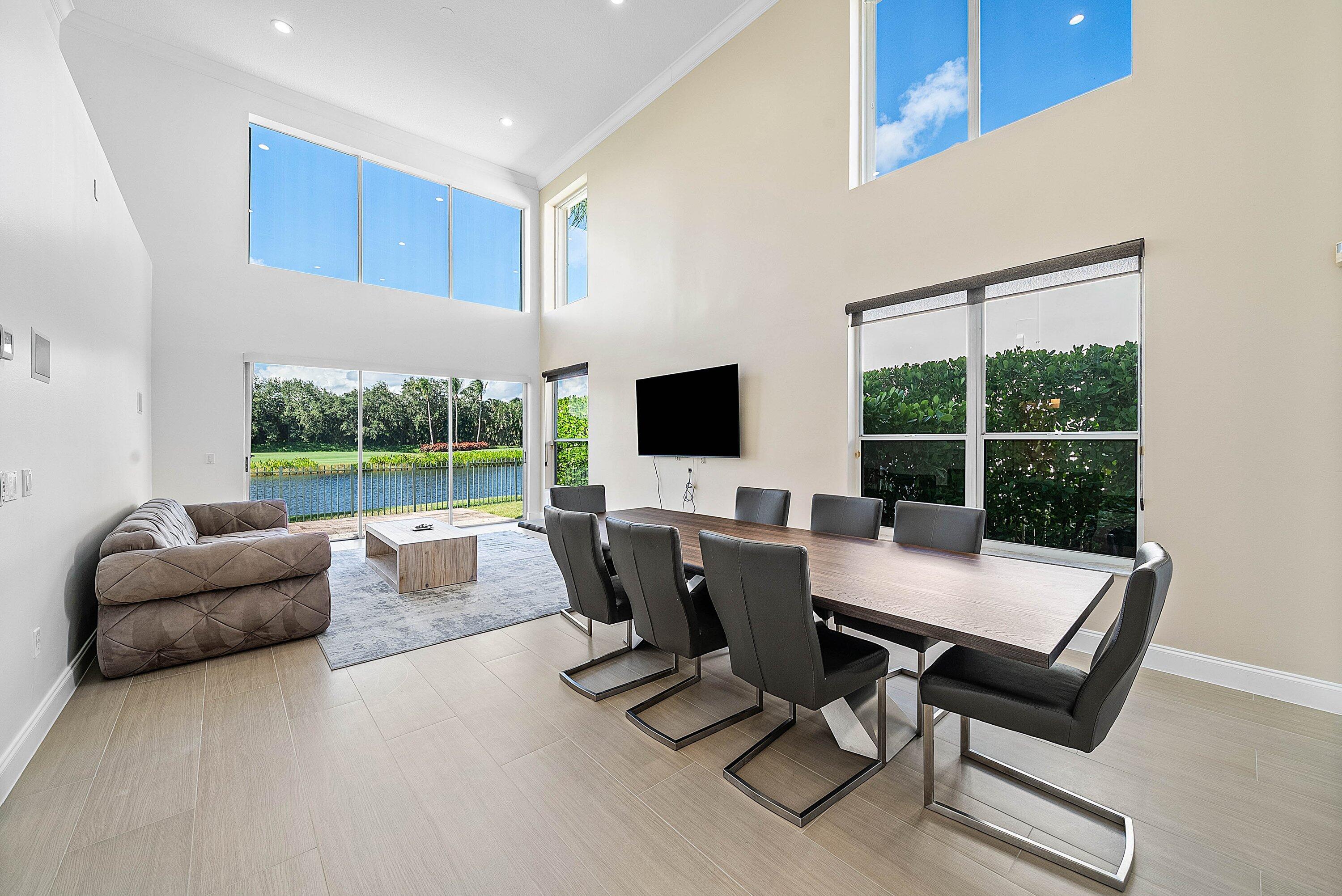 5855 Northwest 42nd Way Boca Raton, FL 33496 - Photo 7 of 77 a view of a livingroom with lounge chair and a large window