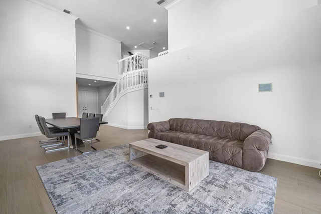 a kitchen with stainless steel appliances granite countertop wooden cabinets a stove top oven a sink and dishwasher