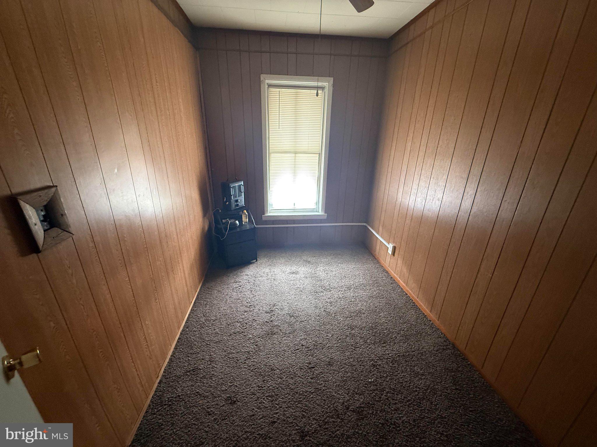 37 North Filbert Street Milton, PA 17847 - Photo 9 of 24 Cozy room with warm wooden accents.