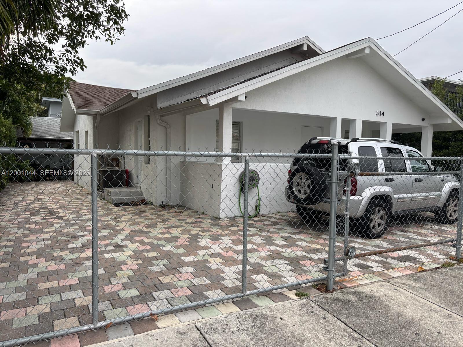 314 Southwest 10th Avenue, Unit 2 Miami, FL 33130 - Photo 1 of 9 a view of a garage with parked cars