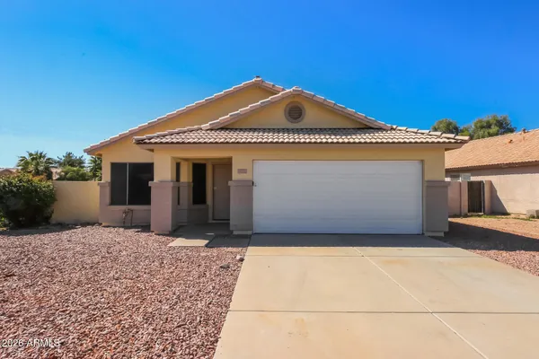 a front view of a house with a garage