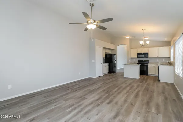 a view of a kitchen with a sink and a refrigerator