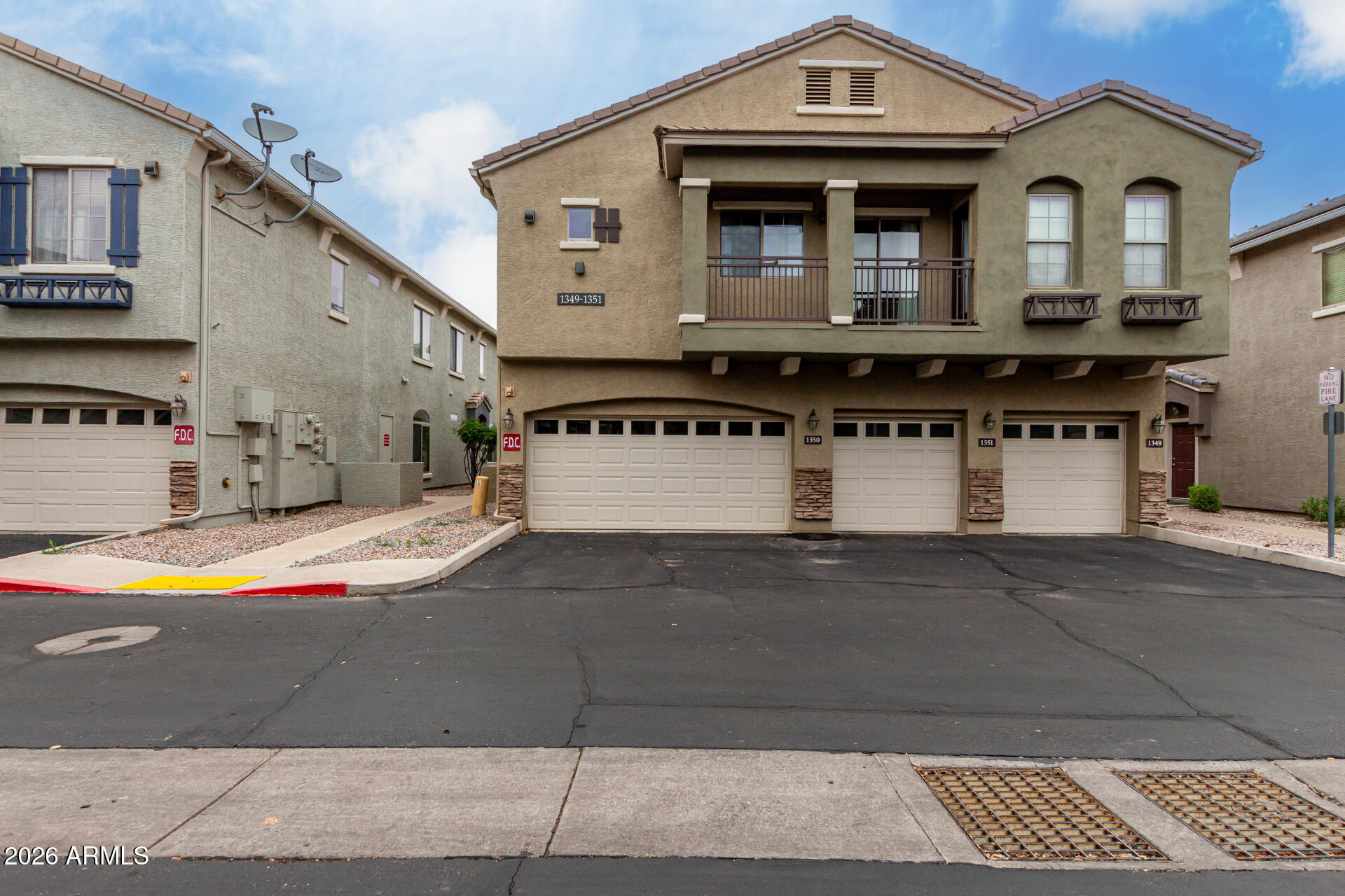 280 South Evergreen Road, Unit 1350 Tempe, AZ 85288 - Photo 1 of 62 a front view of a house with a yard