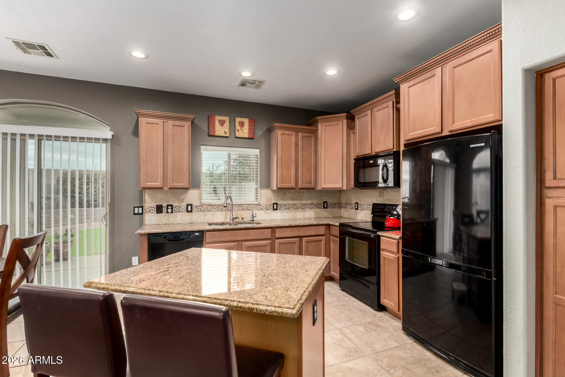 280 South Evergreen Road, Unit 1350 Tempe, AZ 85288 - Photo 14 of 62 a kitchen with stainless steel appliances granite countertop a refrigerator a sink dishwasher a stove and white countertops with wooden floor