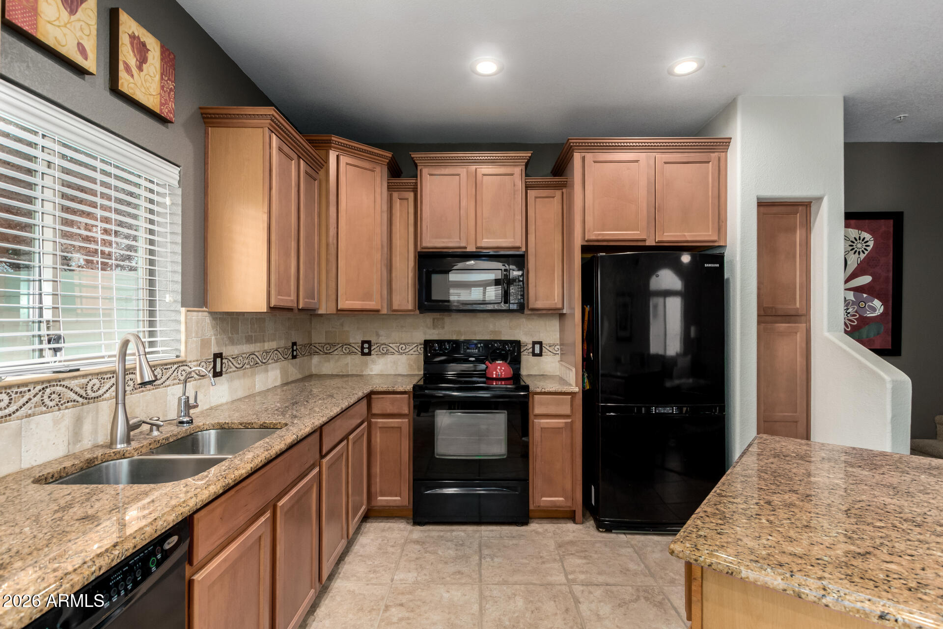 280 South Evergreen Road, Unit 1350 Tempe, AZ 85288 - Photo 16 of 62 a kitchen with stainless steel appliances granite countertop a refrigerator and a sink