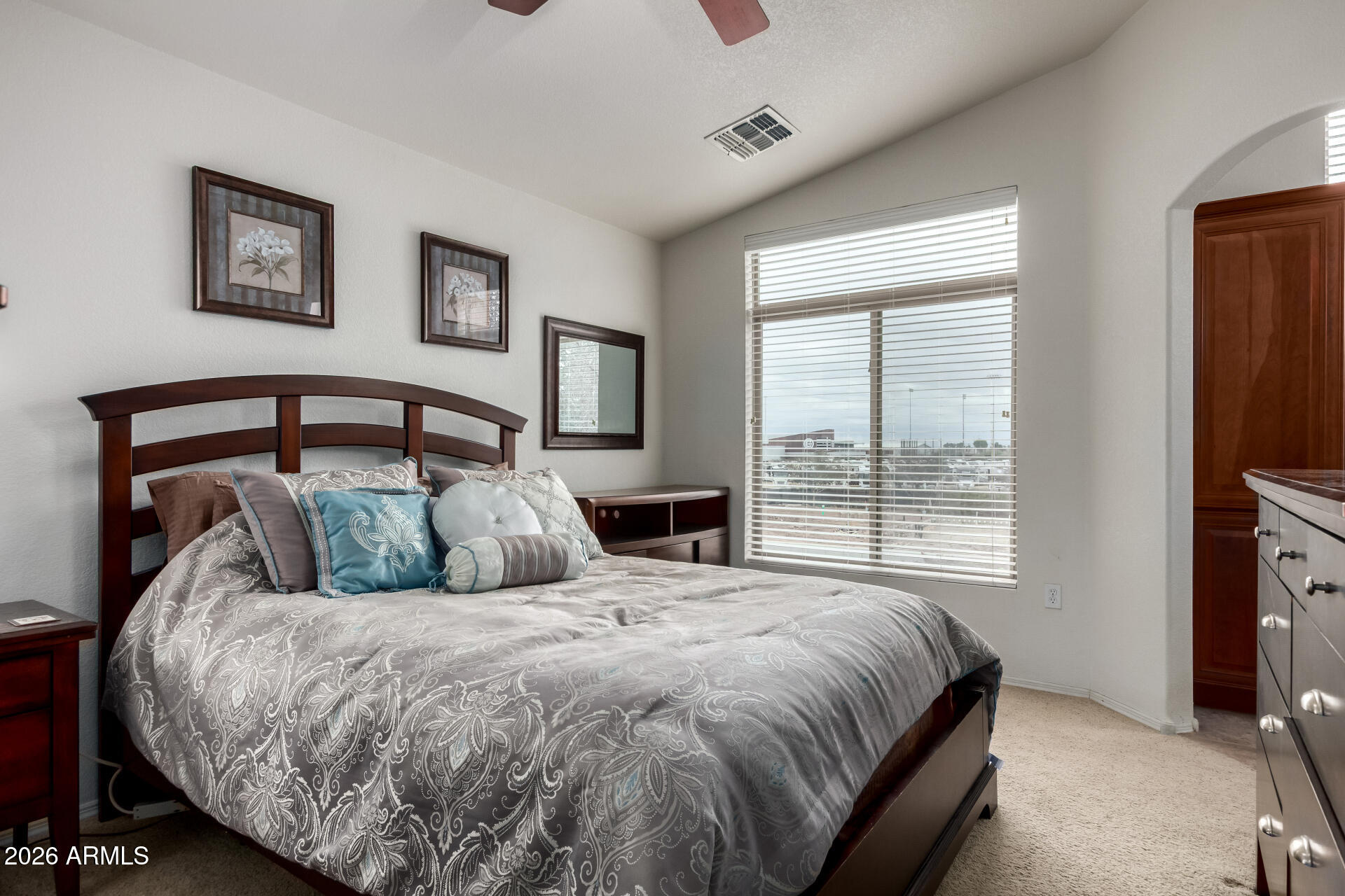 280 South Evergreen Road, Unit 1350 Tempe, AZ 85288 - Photo 19 of 62 a bed sitting in a bedroom next to a window
