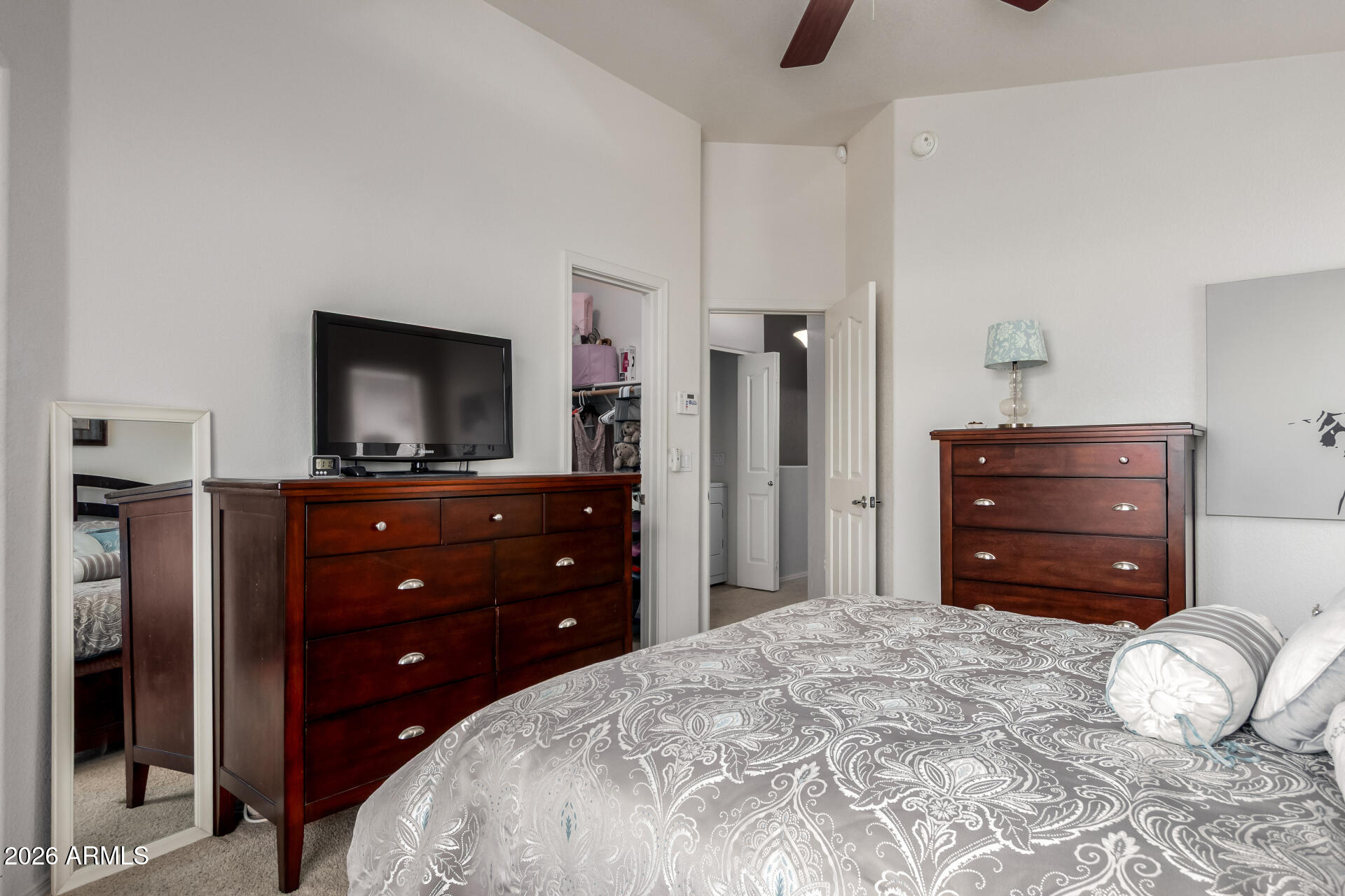 280 South Evergreen Road, Unit 1350 Tempe, AZ 85288 - Photo 20 of 62 a bedroom with a bed and a television