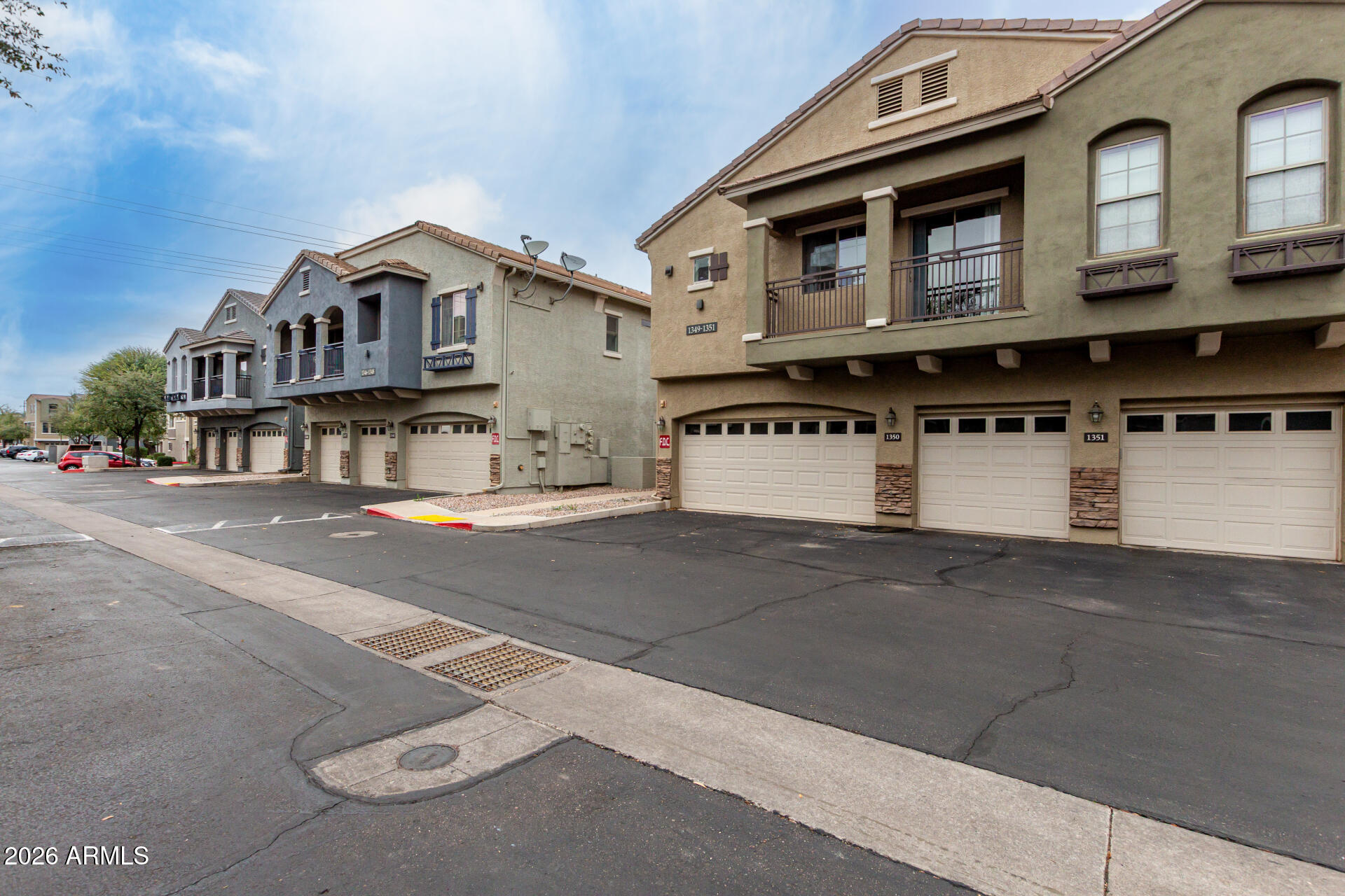 280 South Evergreen Road, Unit 1350 Tempe, AZ 85288 - Photo 2 of 62 a view of a white house with large windows
