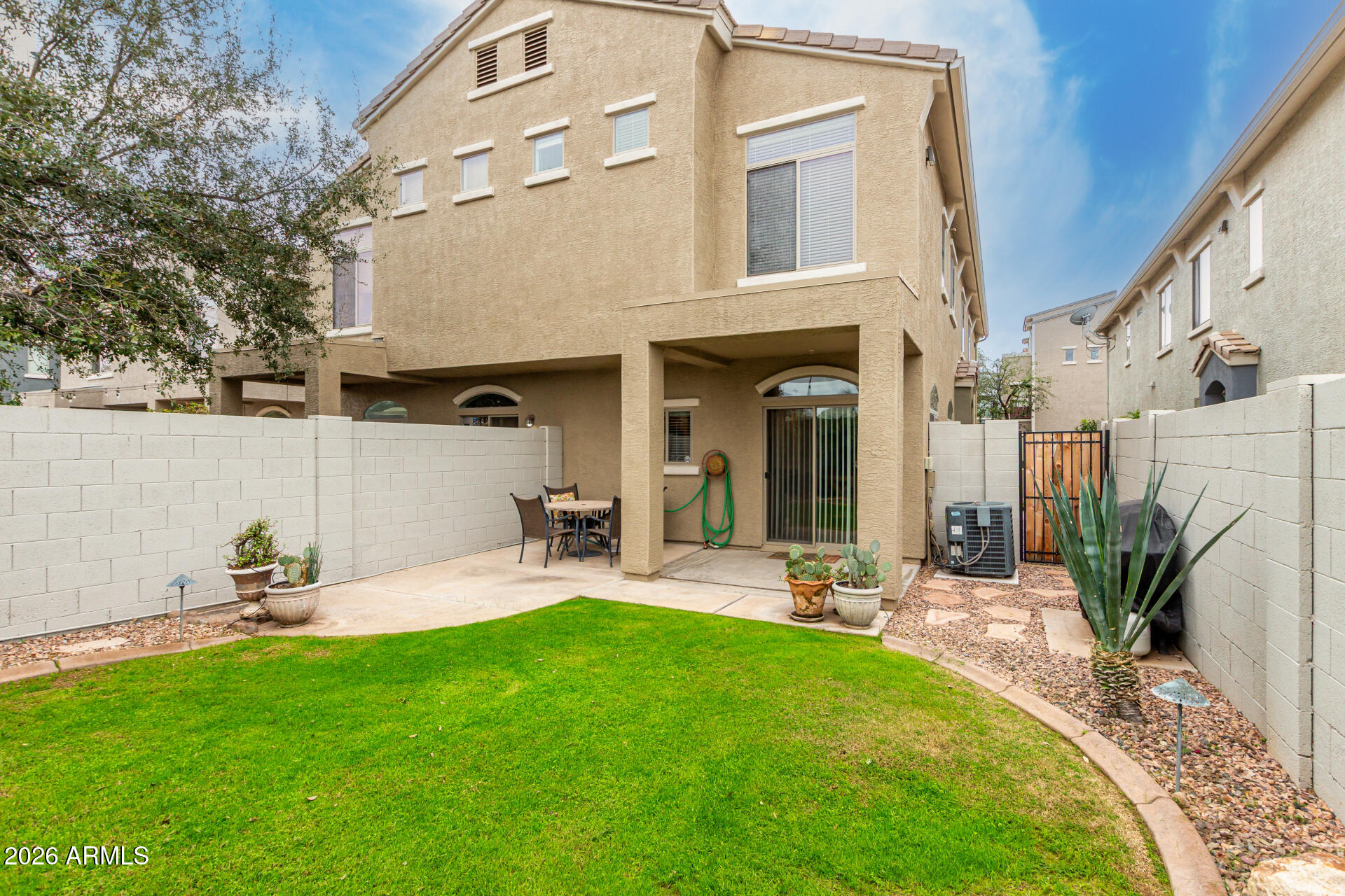 280 South Evergreen Road, Unit 1350 Tempe, AZ 85288 - Photo 34 of 62 a front view of a house with patio