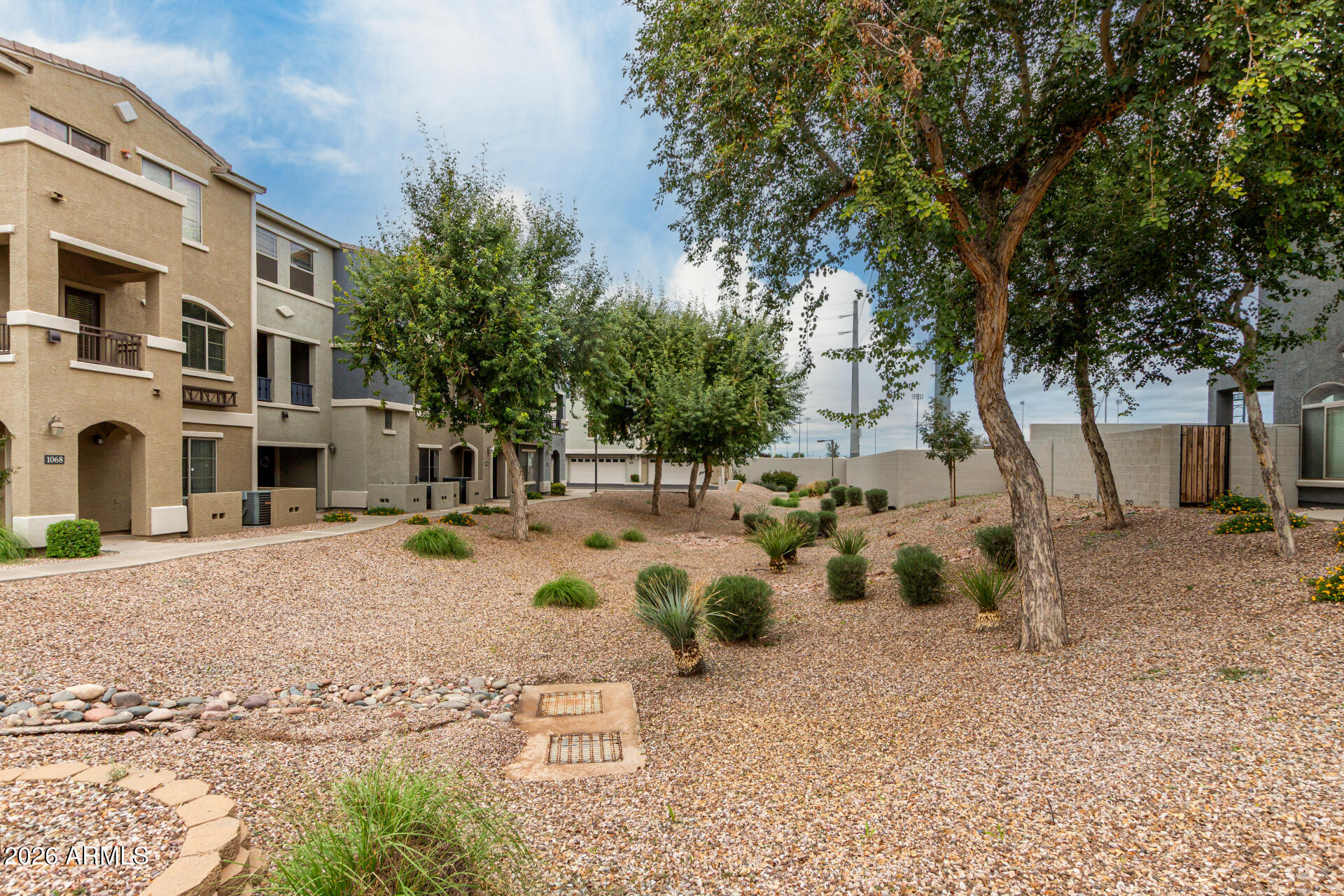 280 South Evergreen Road, Unit 1350 Tempe, AZ 85288 - Photo 40 of 62 a view of a backyard with table and chairs