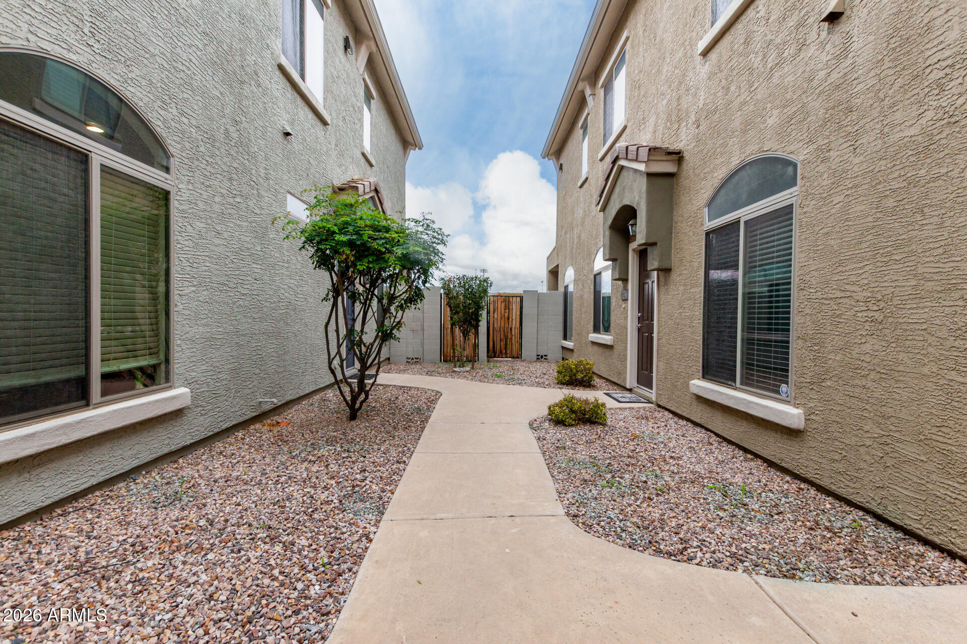 280 South Evergreen Road, Unit 1350 Tempe, AZ 85288 - Photo 4 of 62 a view of a building with potted plants