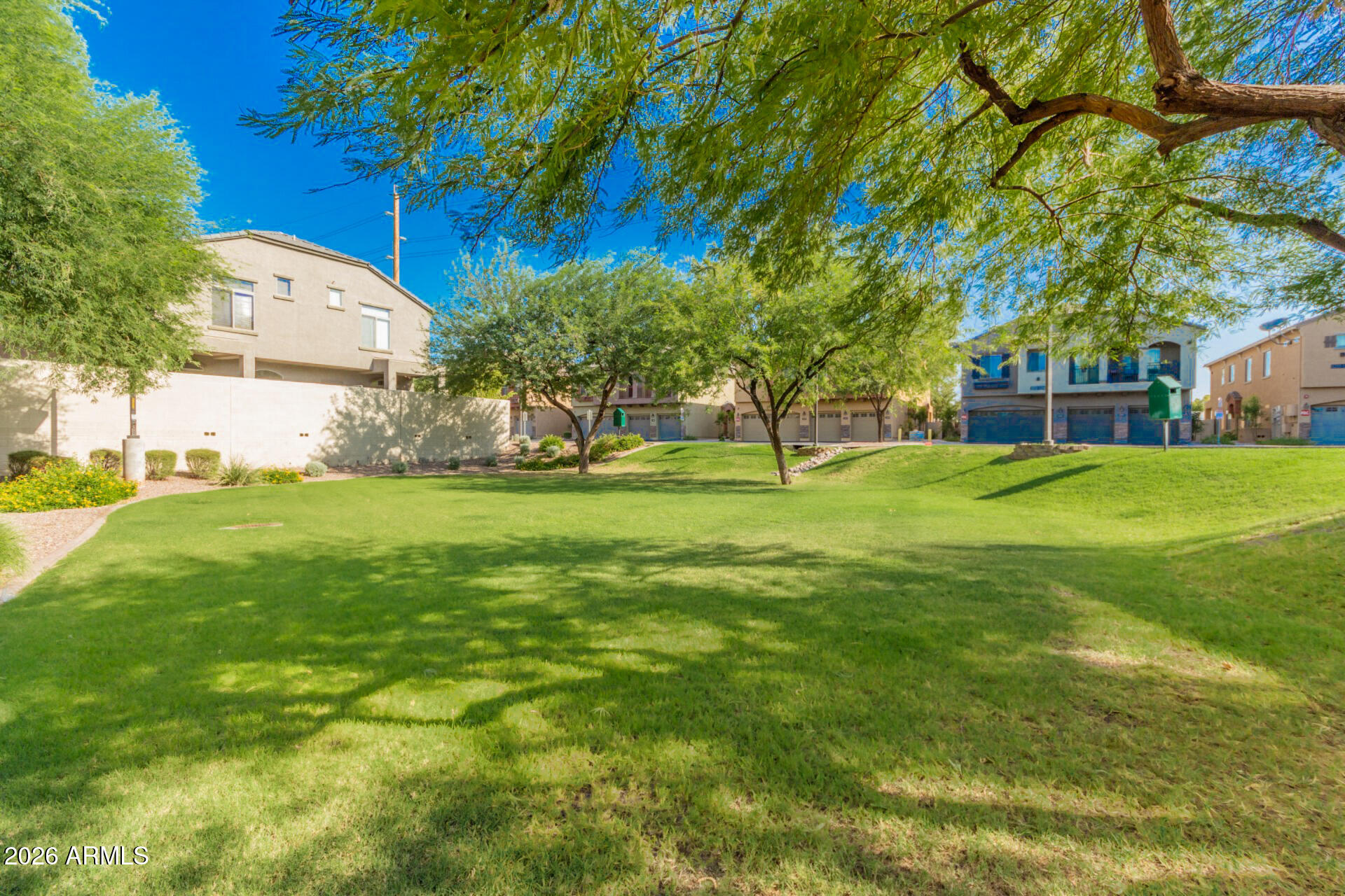 280 South Evergreen Road, Unit 1350 Tempe, AZ 85288 - Photo 44 of 62 a view of a tree in front of a house