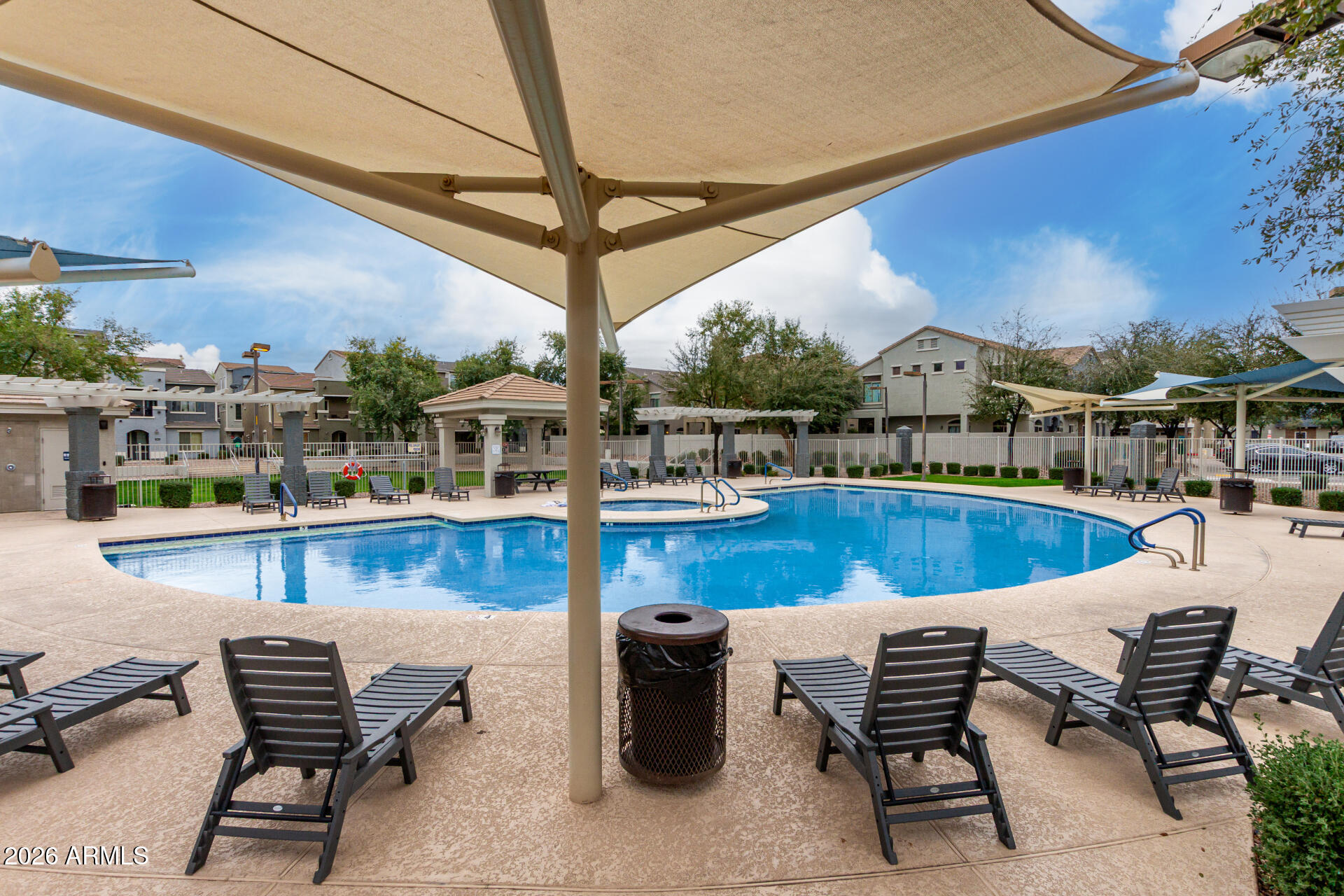 280 South Evergreen Road, Unit 1350 Tempe, AZ 85288 - Photo 47 of 62 a view of a swimming pool with sitting area