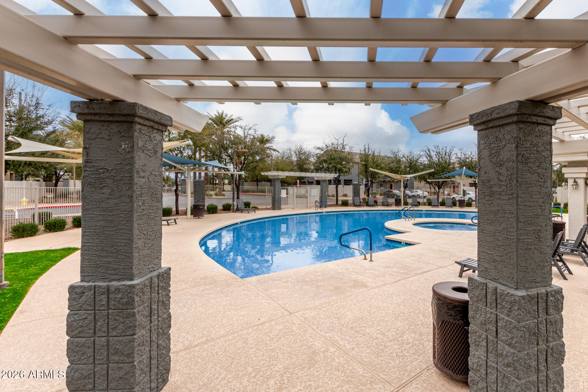 280 South Evergreen Road, Unit 1350 Tempe, AZ 85288 - Photo 49 of 62 a view of a swimming pool with a patio