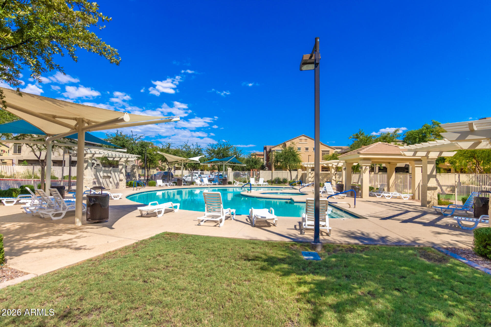280 South Evergreen Road, Unit 1350 Tempe, AZ 85288 - Photo 56 of 62 a view of a swimming pool with a patio
