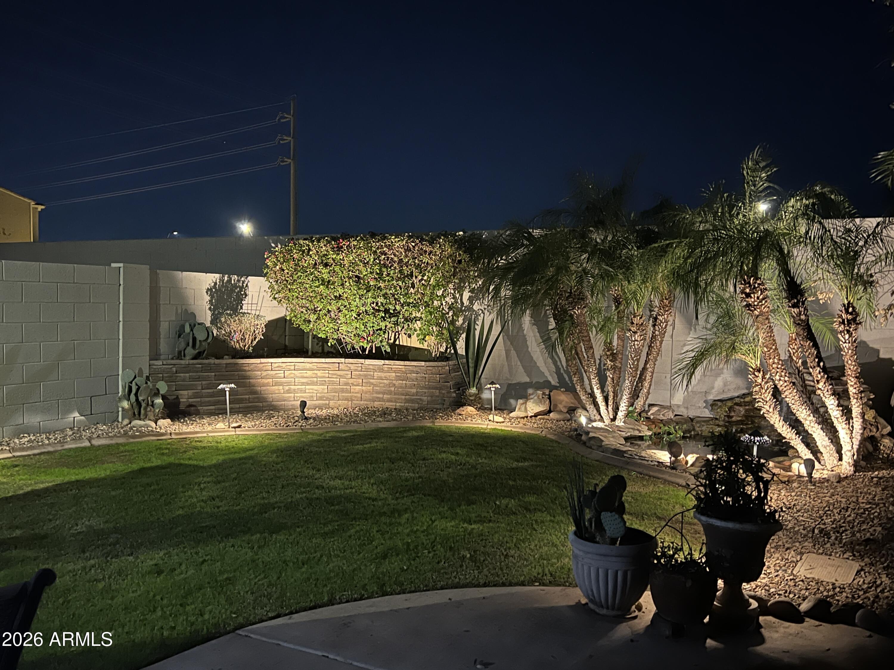 280 South Evergreen Road, Unit 1350 Tempe, AZ 85288 - Photo 62 of 62 a view of backyard with swimming pool and outdoor seating
