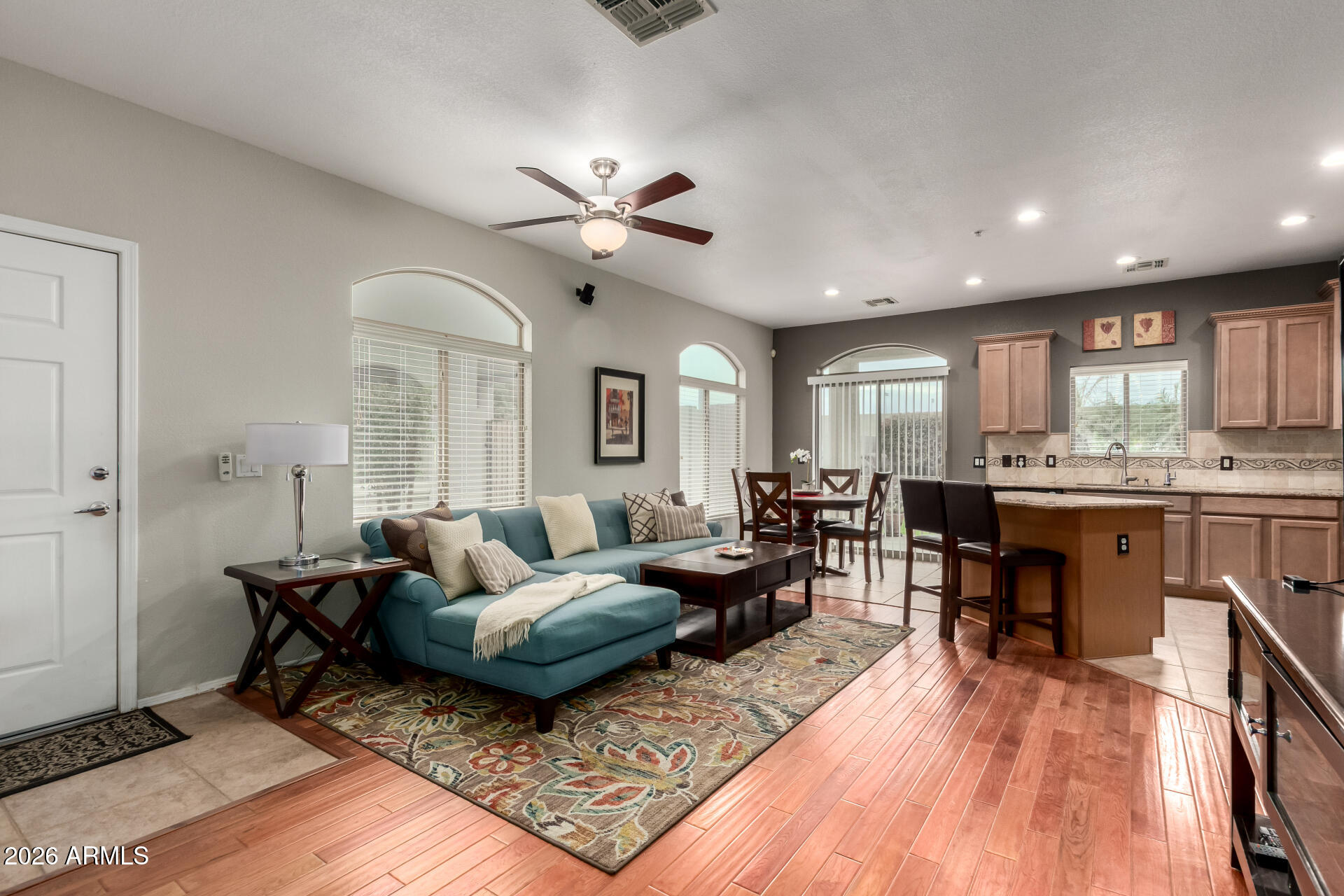 280 South Evergreen Road, Unit 1350 Tempe, AZ 85288 - Photo 9 of 62 a living room with furniture and a wooden floor