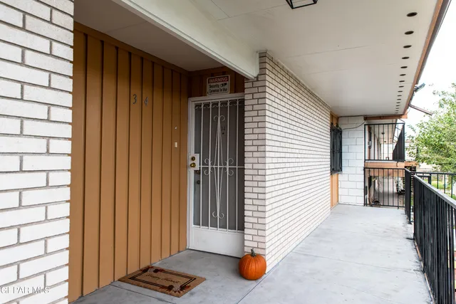 a view of a porch with wooden floor and furniture