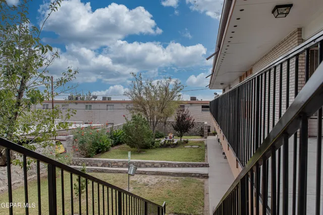 a view of a swimming pool with a garden