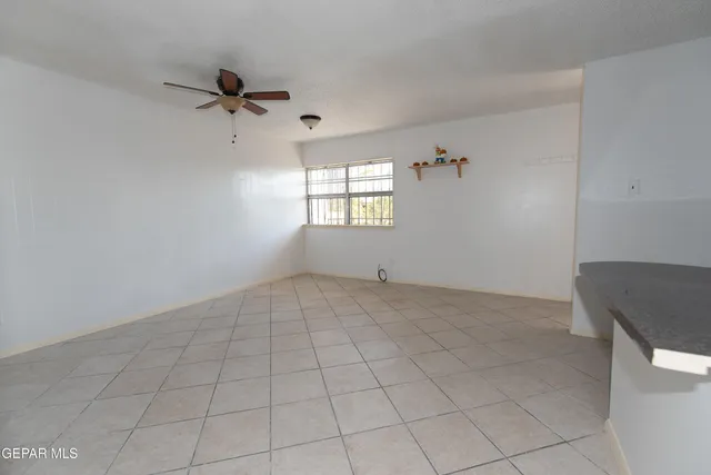 a view of an empty room and window